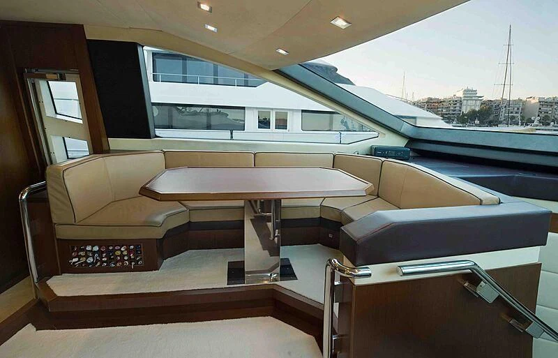 a room with a couch and a table aboard KOUKLES Yacht for Sale