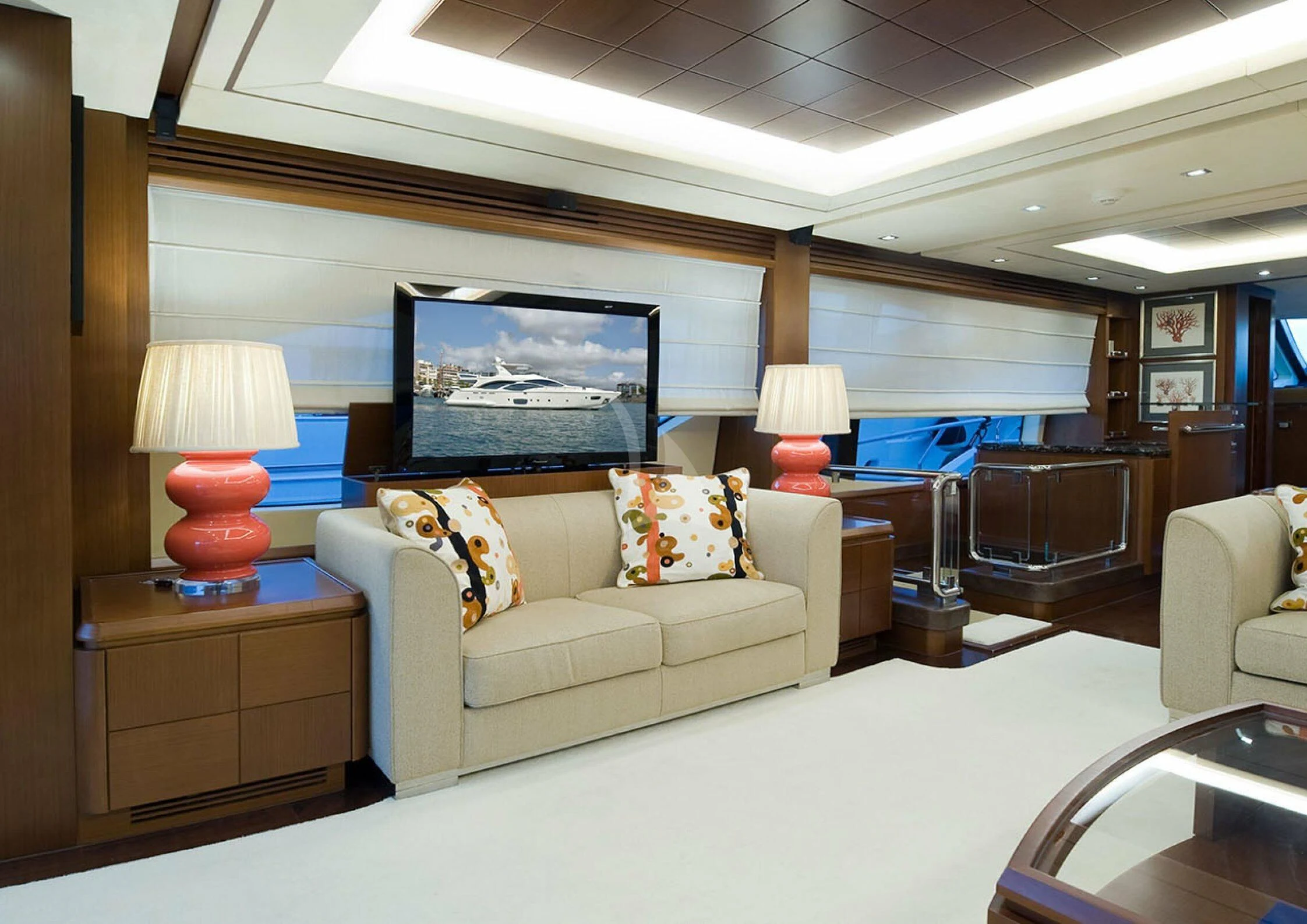 a living room with a couch and a television aboard KOUKLES Yacht for Sale