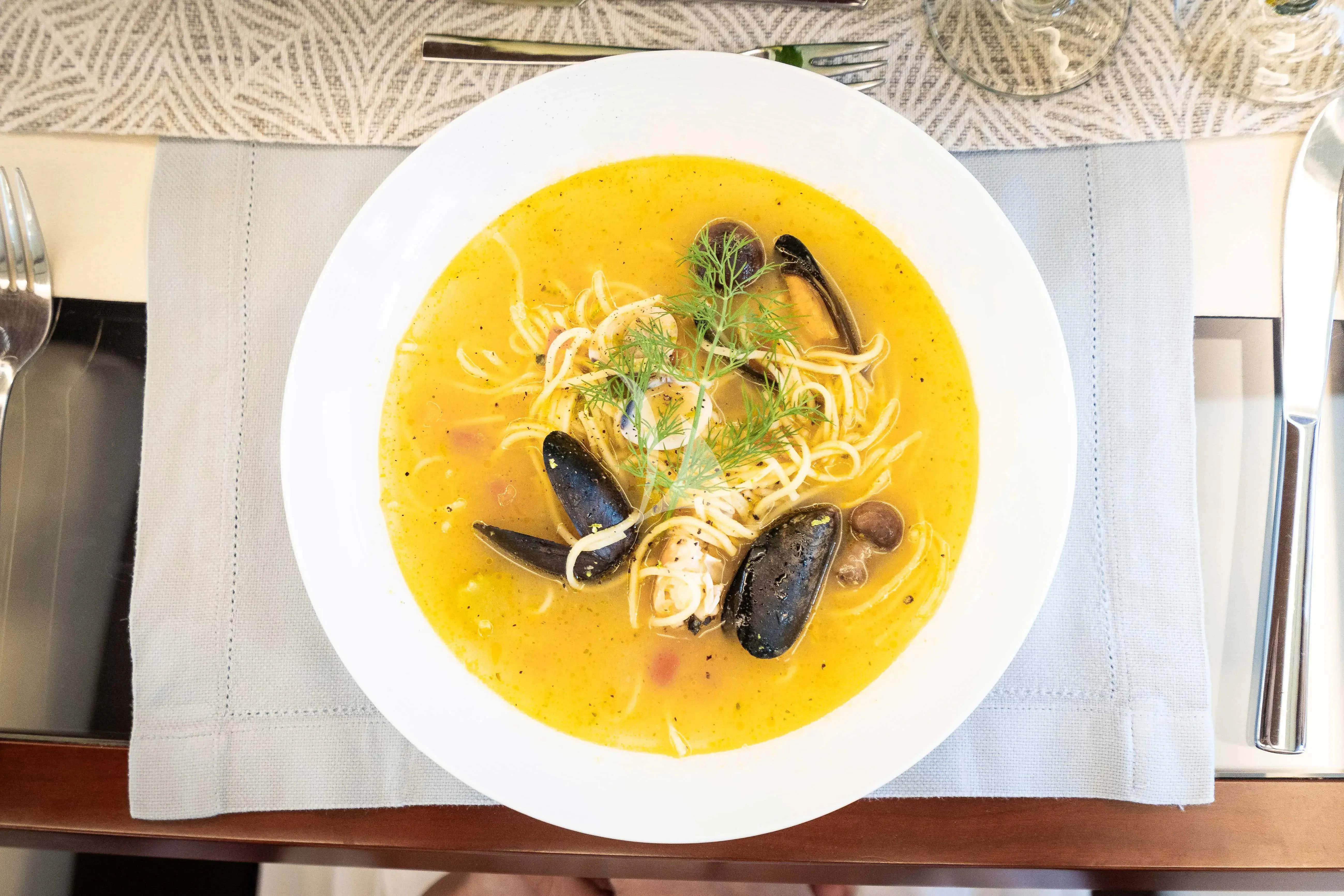 a bowl of soup aboard KOUKLES Yacht for Sale
