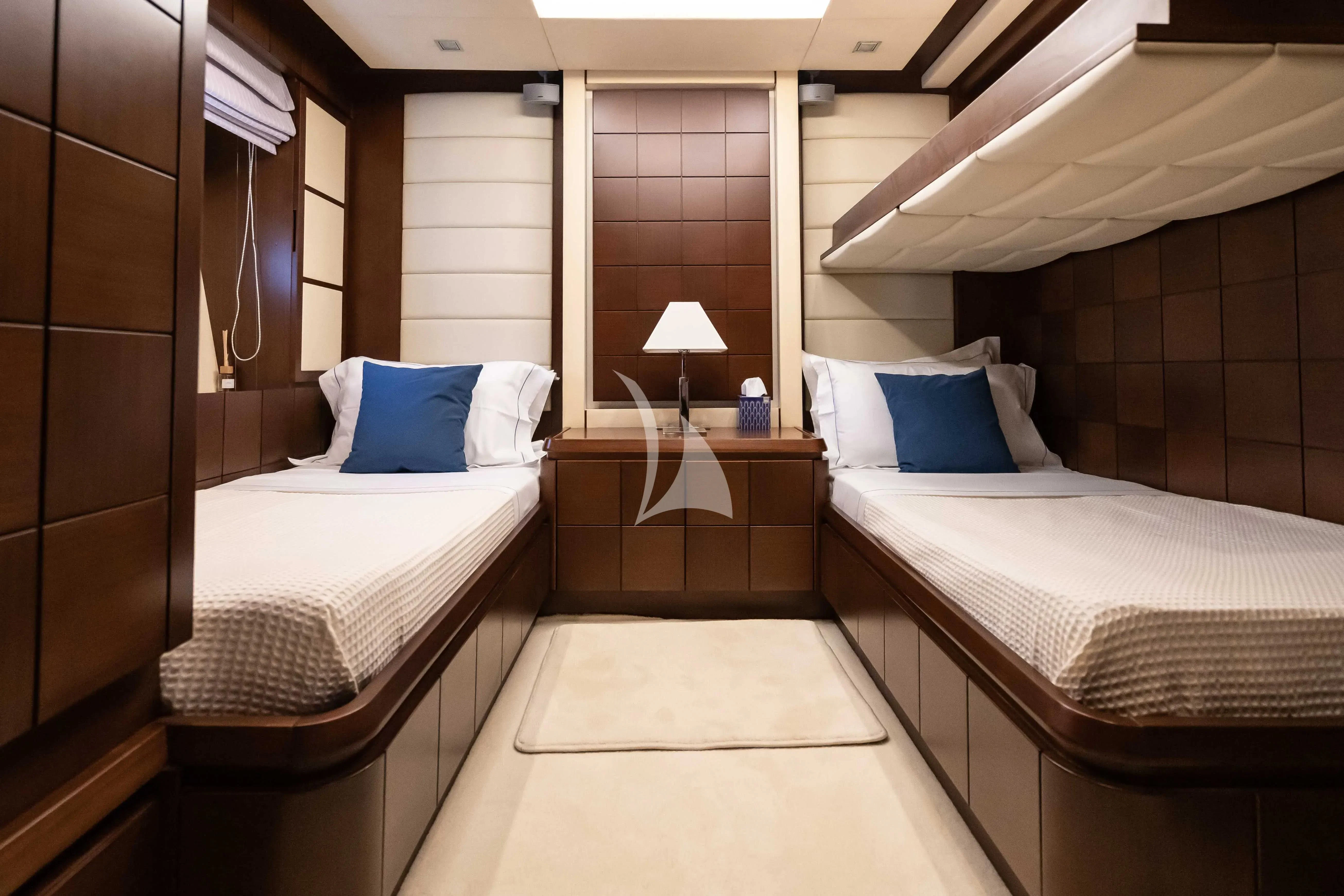 a room with two beds aboard KOUKLES Yacht for Sale