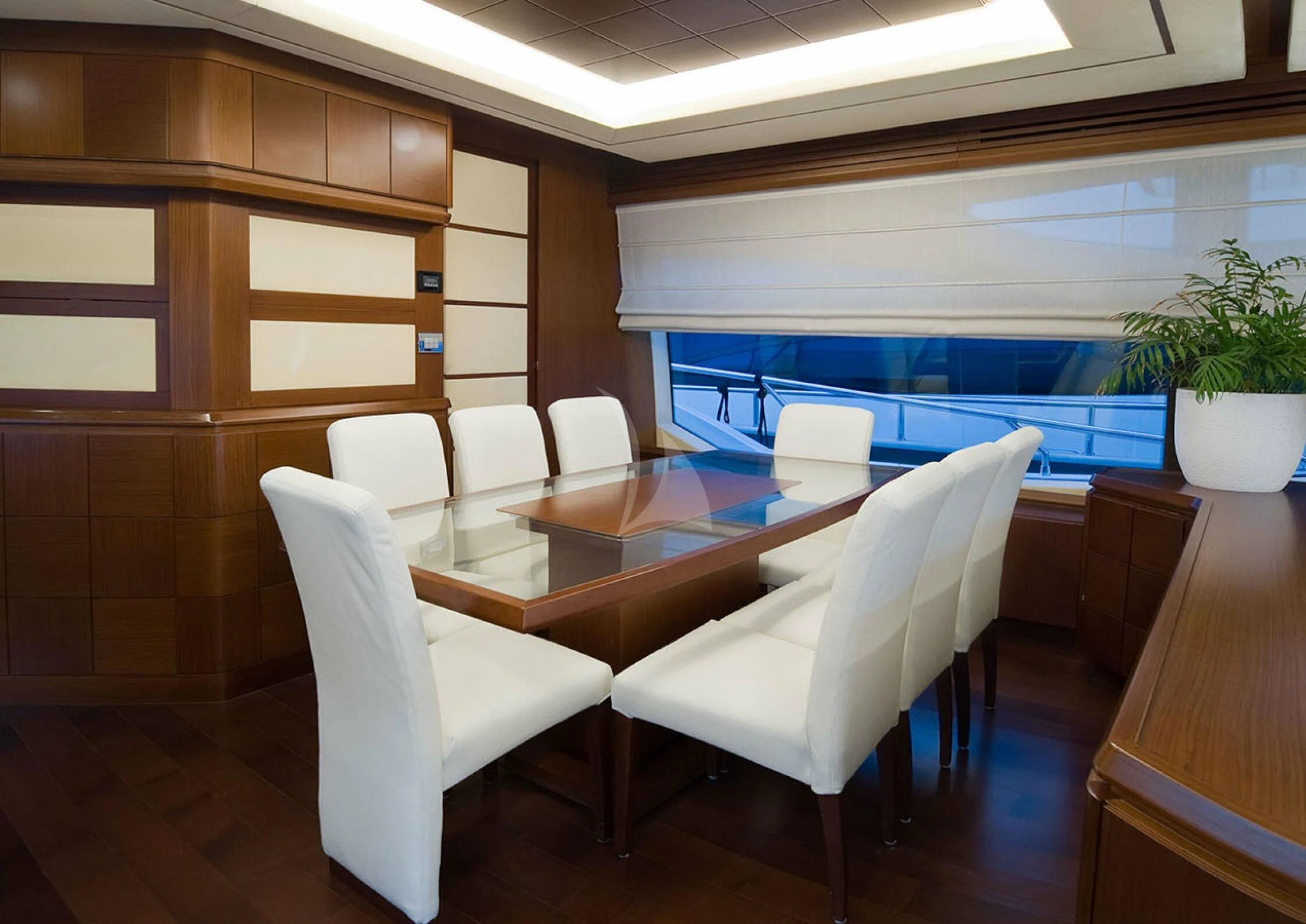 a room with chairs and a table aboard KOUKLES Yacht for Sale