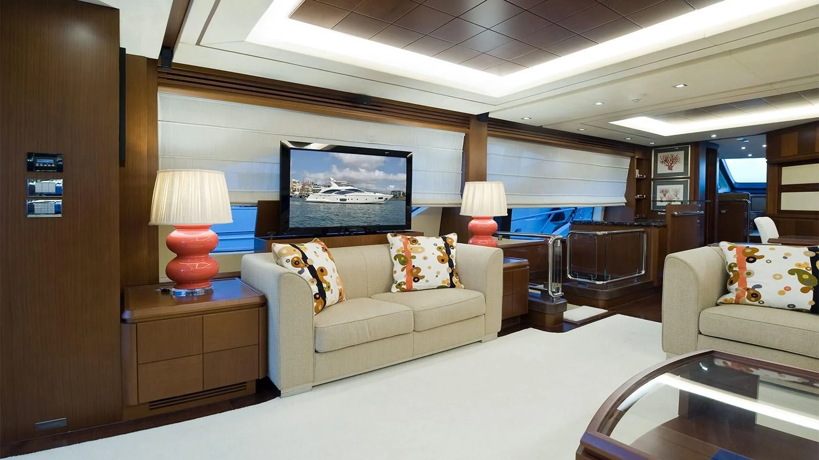 a living room with a couch and a television aboard KOUKLES Yacht for Sale