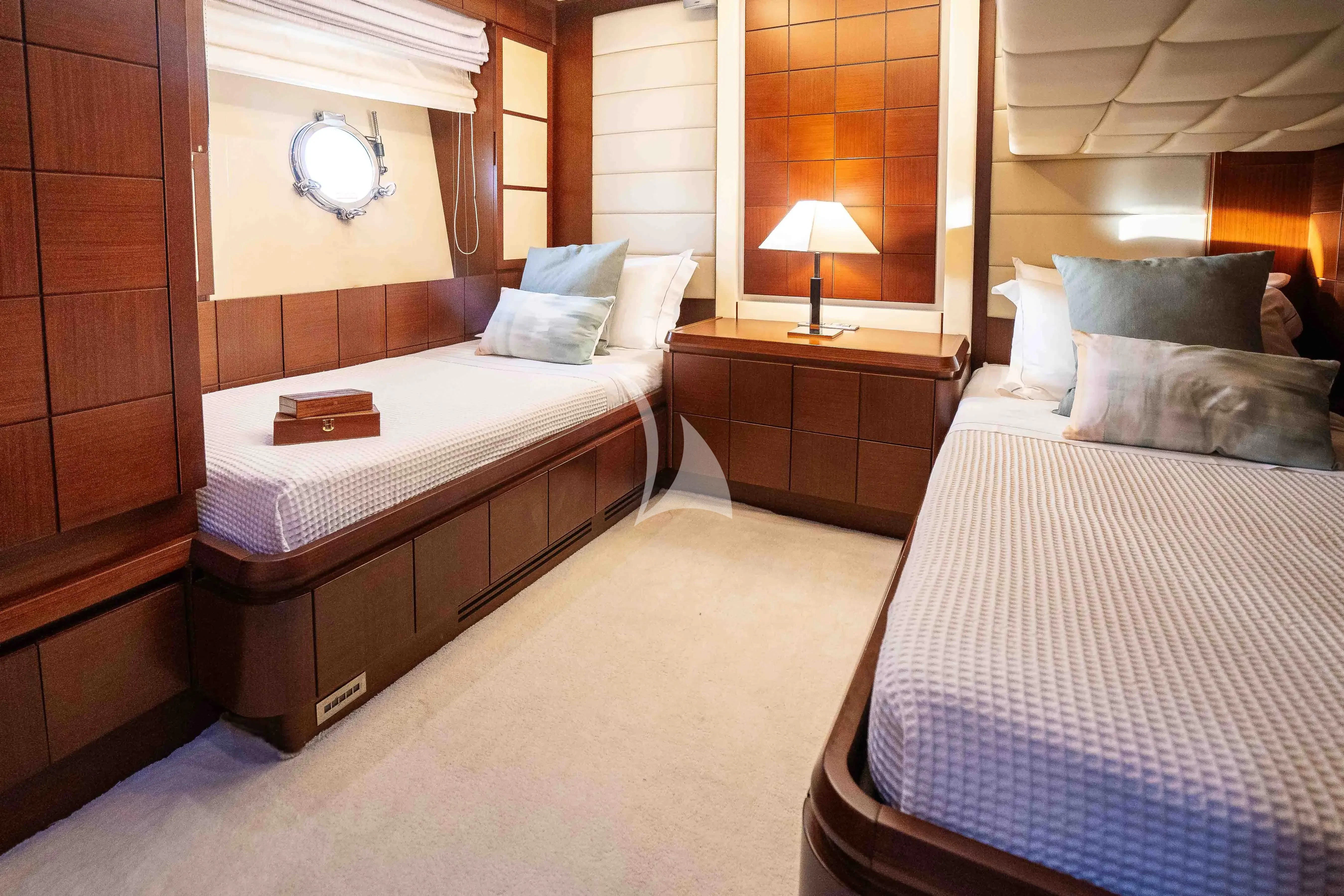a room with two beds aboard KOUKLES Yacht for Sale