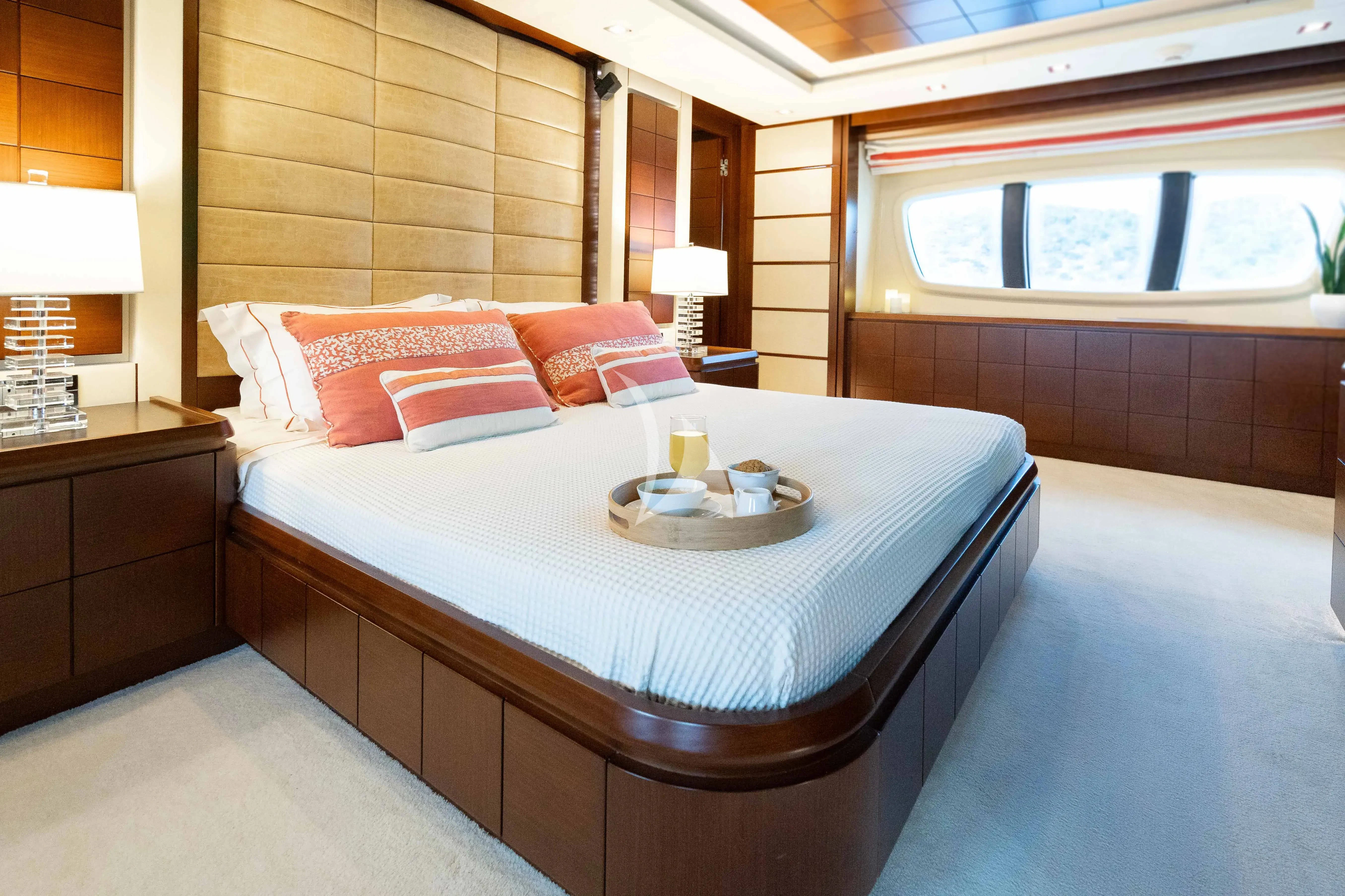 a hotel room with a bed and a table aboard KOUKLES Yacht for Sale