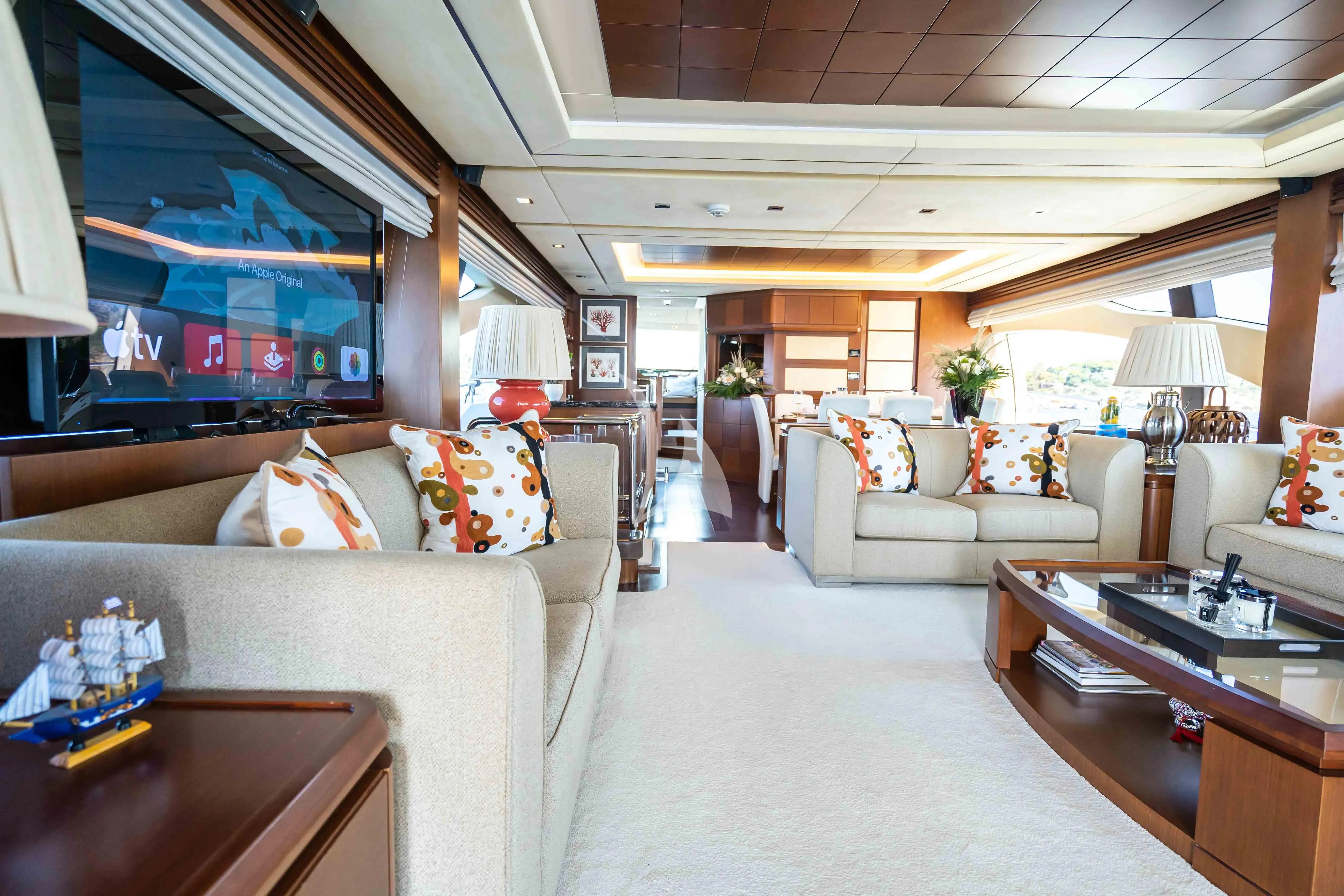 a living room with a couch and a table aboard KOUKLES Yacht for Sale