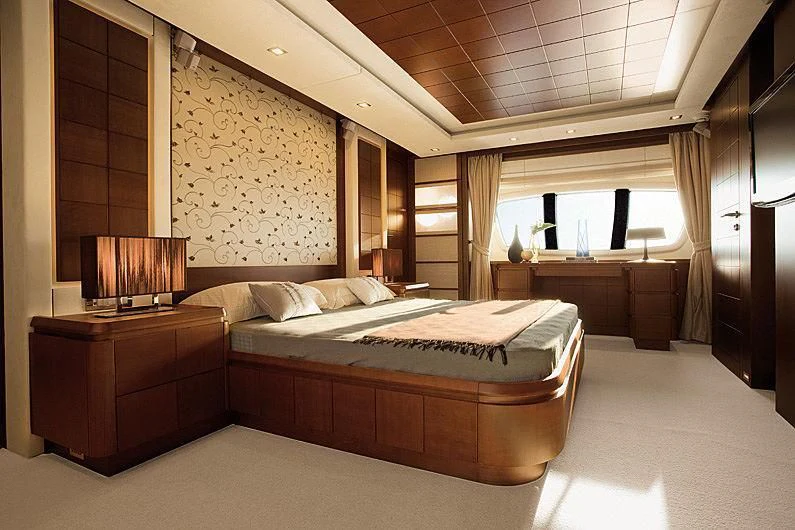 a large bedroom with a large bed aboard KOUKLES Yacht for Sale