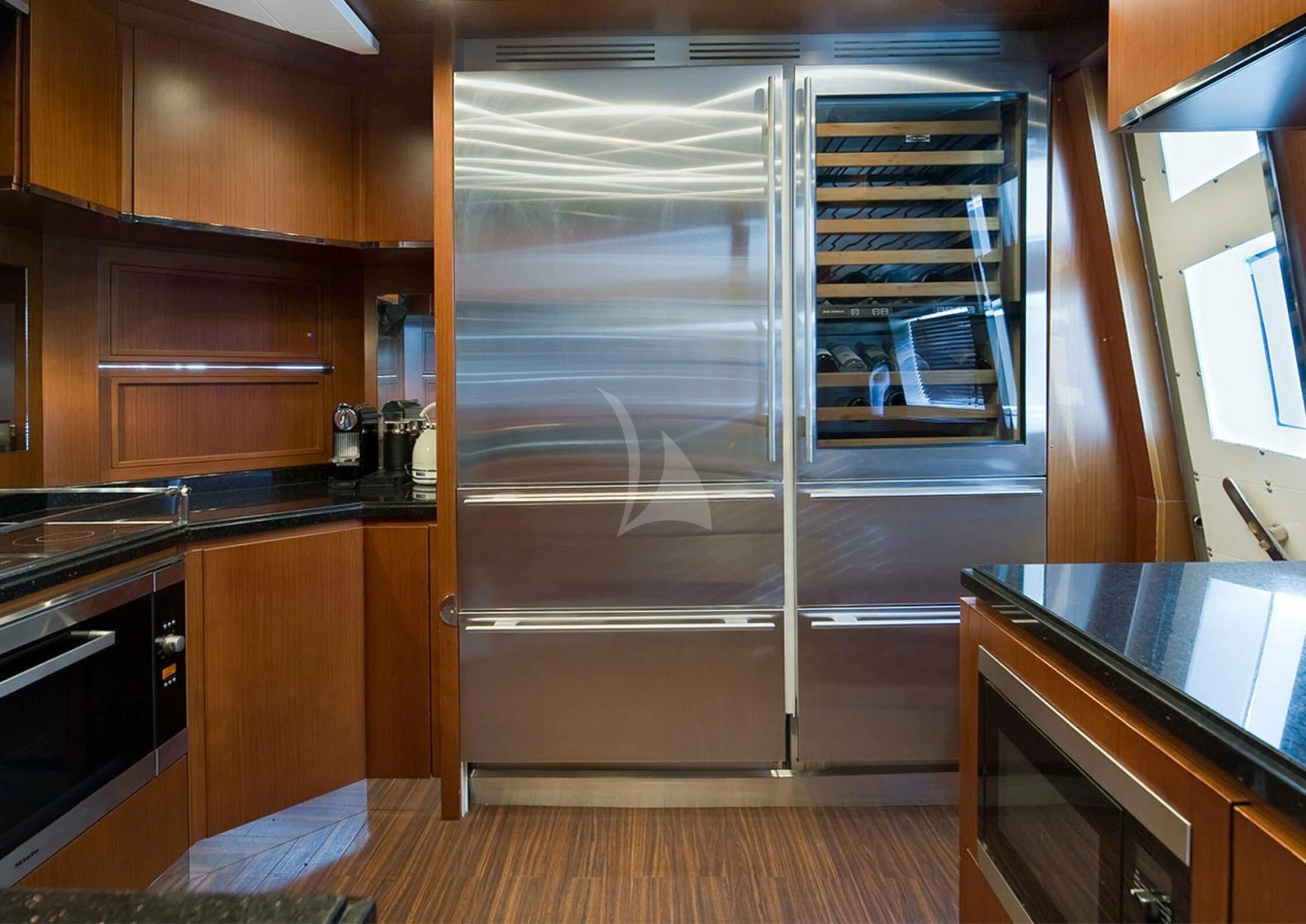 a large refrigerator in a kitchen aboard KOUKLES Yacht for Sale