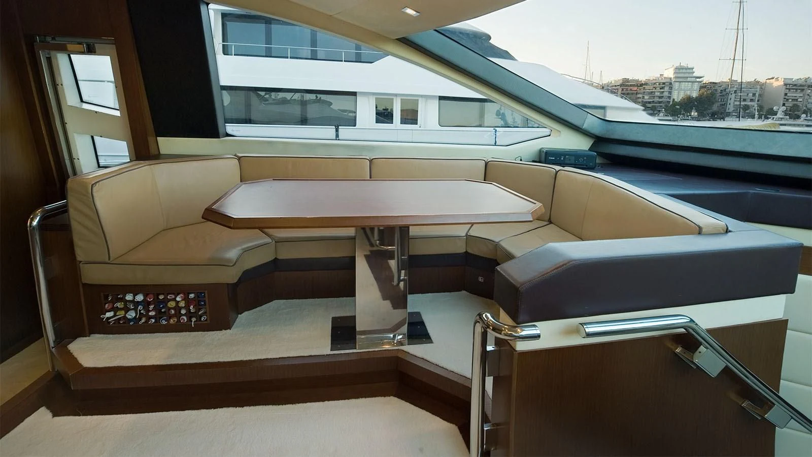 a room with a table and chairs aboard KOUKLES Yacht for Sale