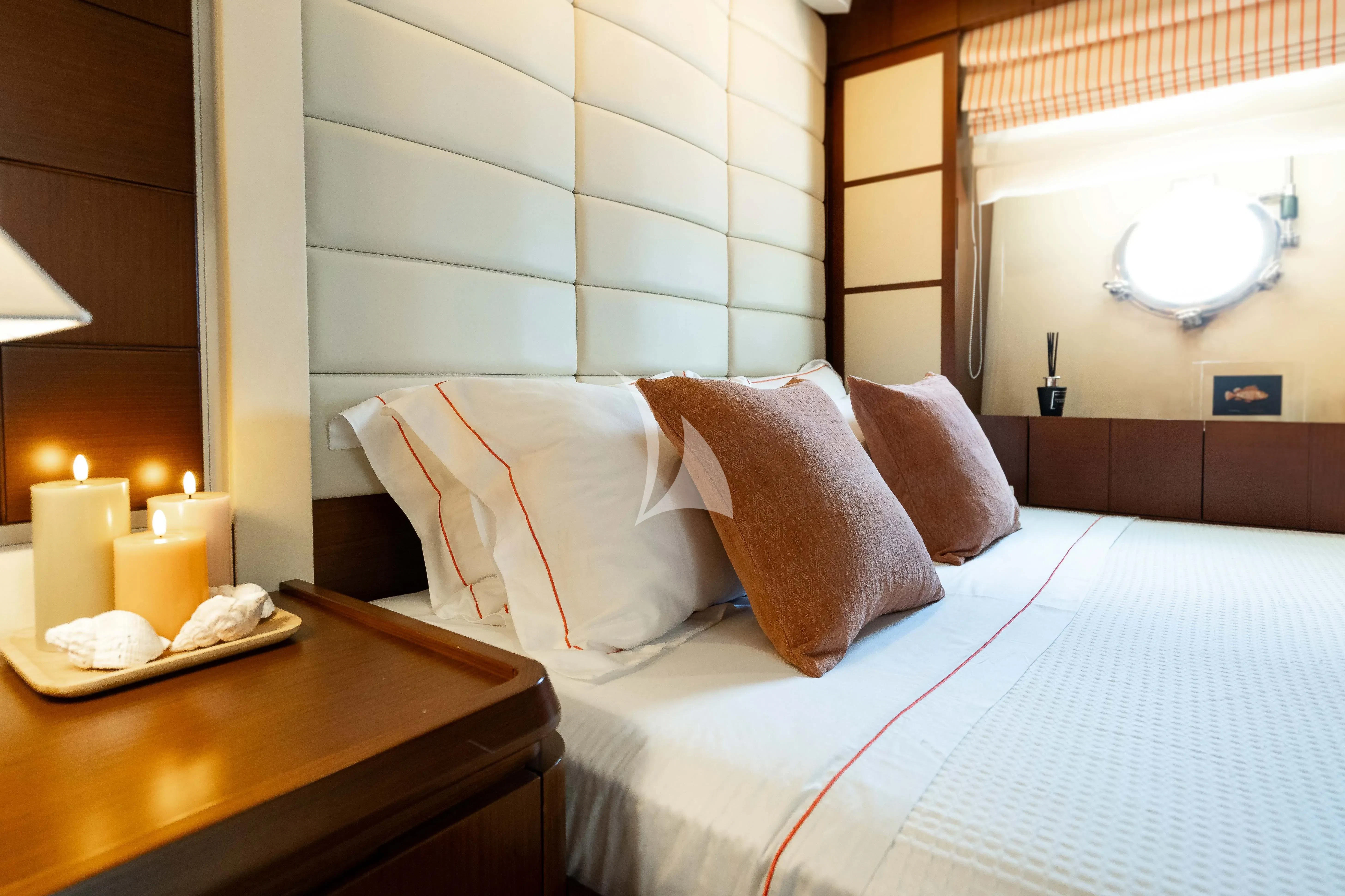a hotel room with a bed and a table aboard KOUKLES Yacht for Sale