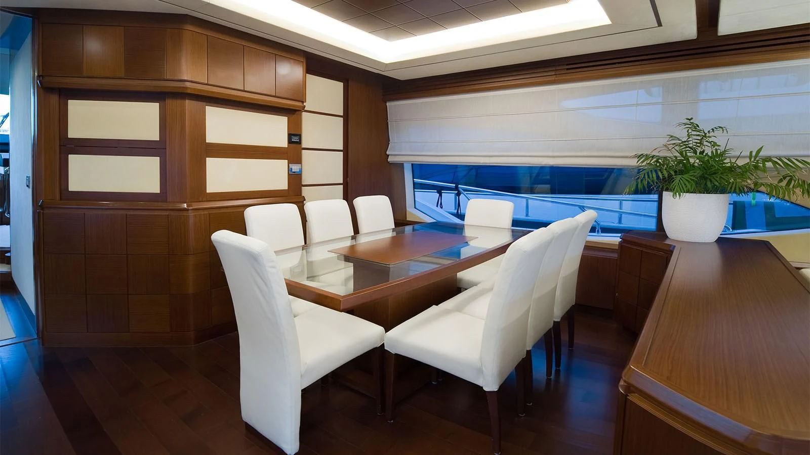 a room with chairs and a table aboard KOUKLES Yacht for Sale