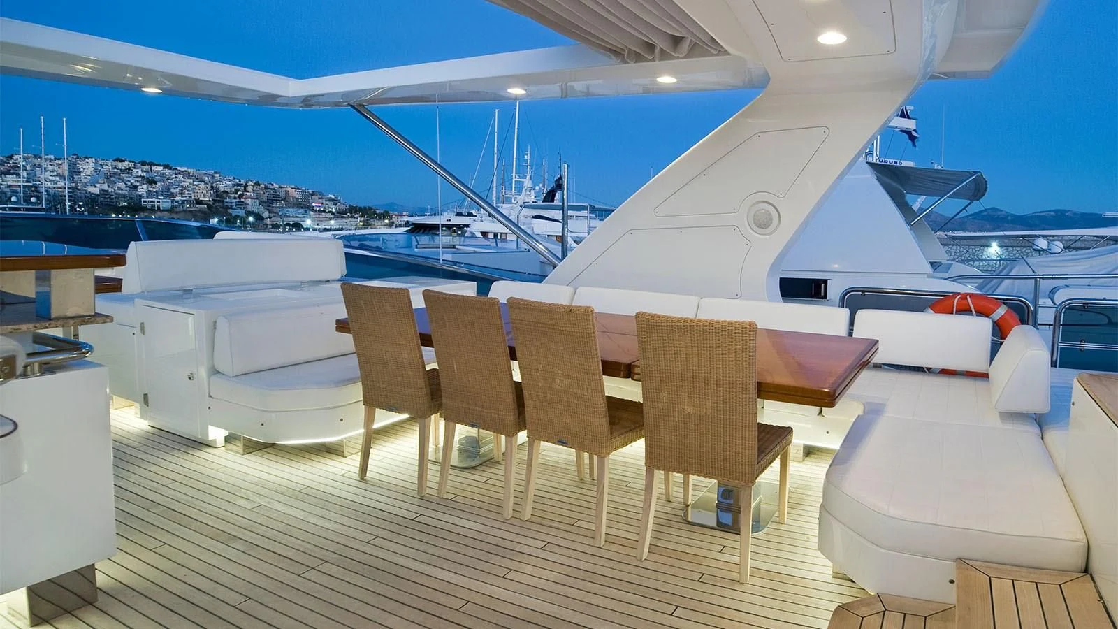 a deck with chairs and a view of the water aboard KOUKLES Yacht for Sale