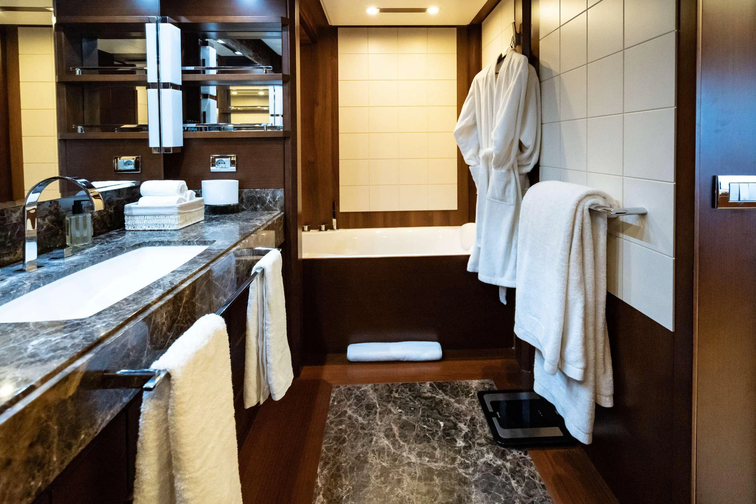 a bathroom with a sink and towels aboard KOUKLES Yacht for Sale