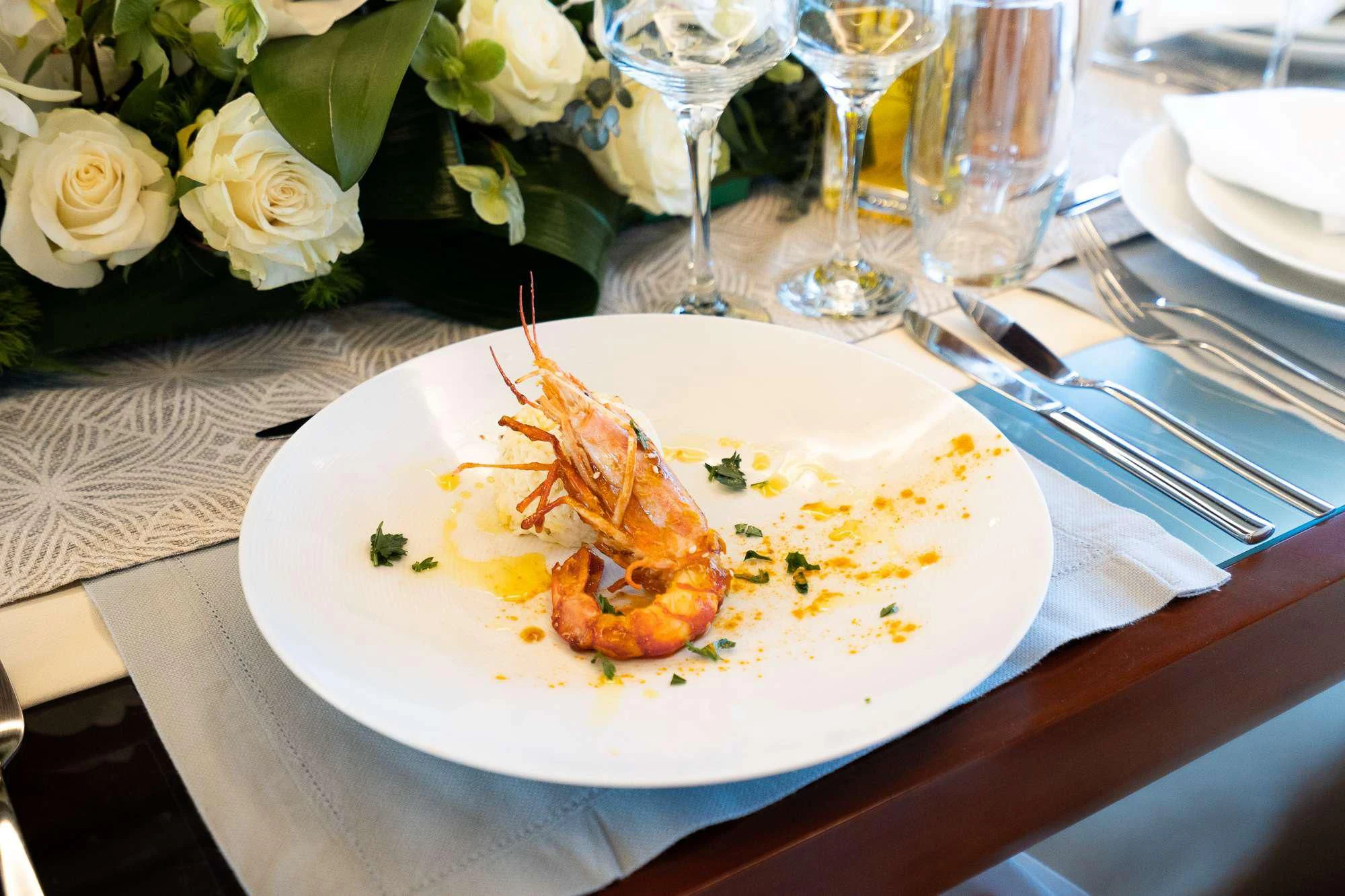 a plate of food aboard KOUKLES Yacht for Sale