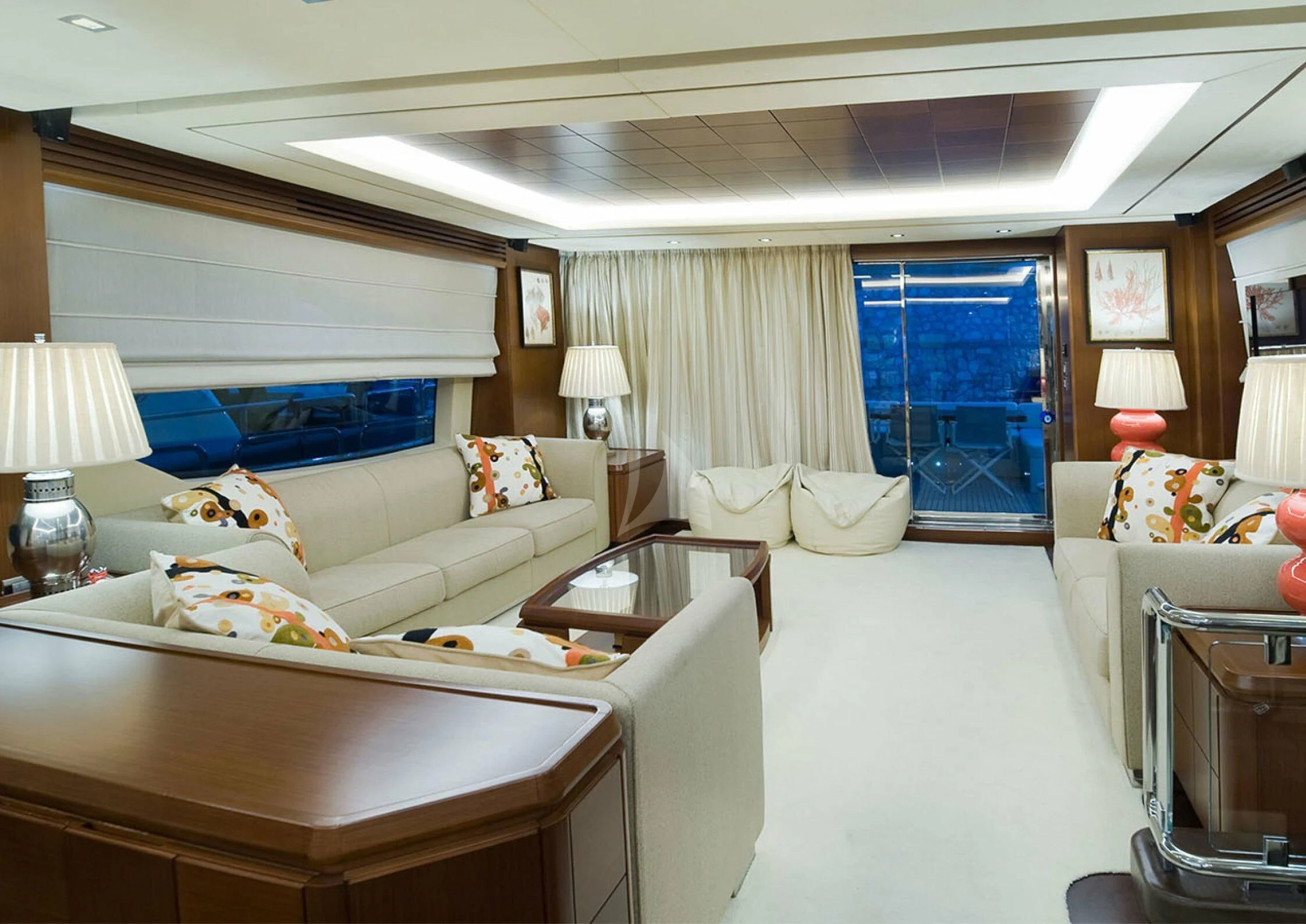 a living room with a large blue curtain aboard KOUKLES Yacht for Sale