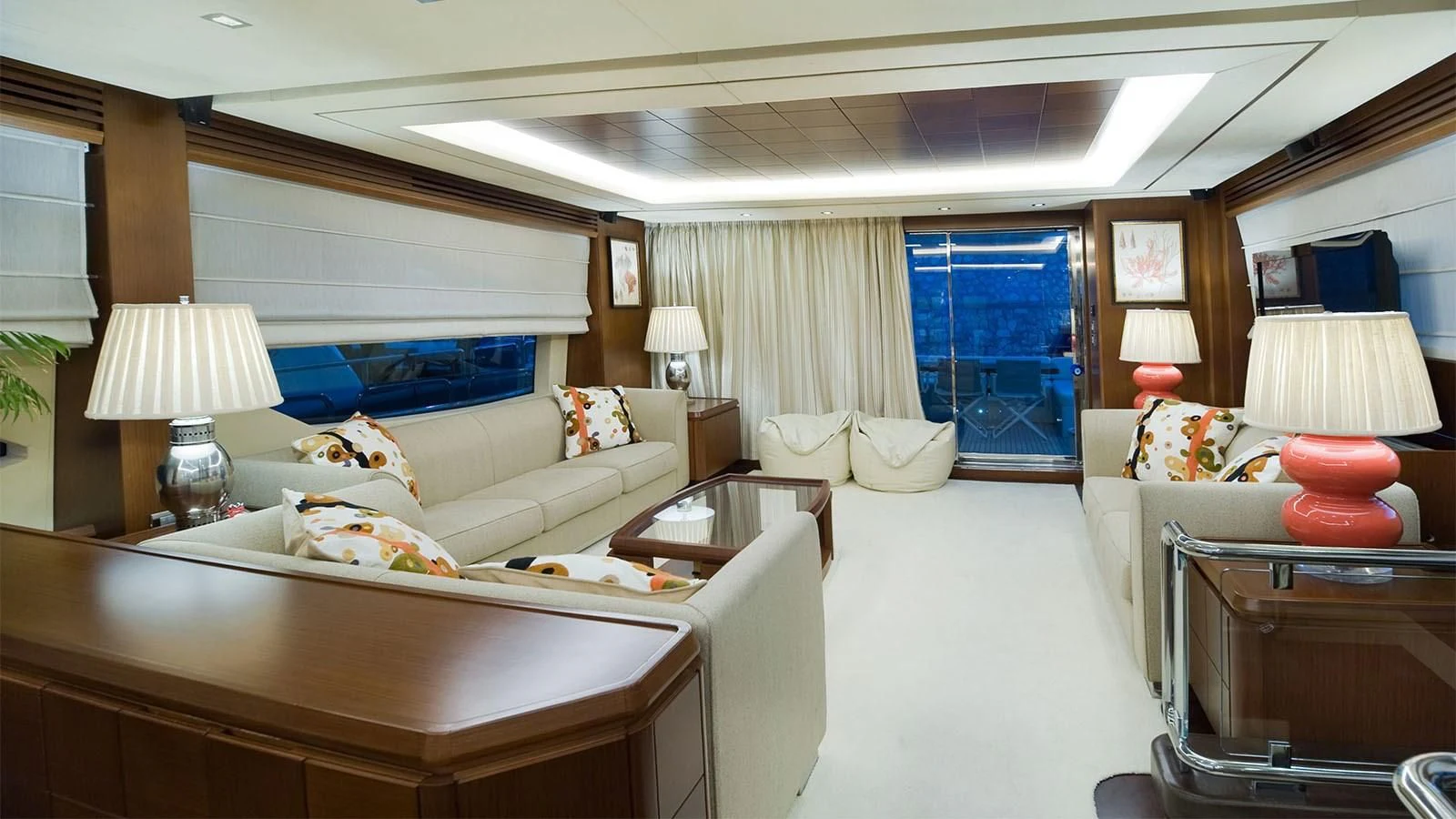a large white living room with a blue door aboard KOUKLES Yacht for Sale