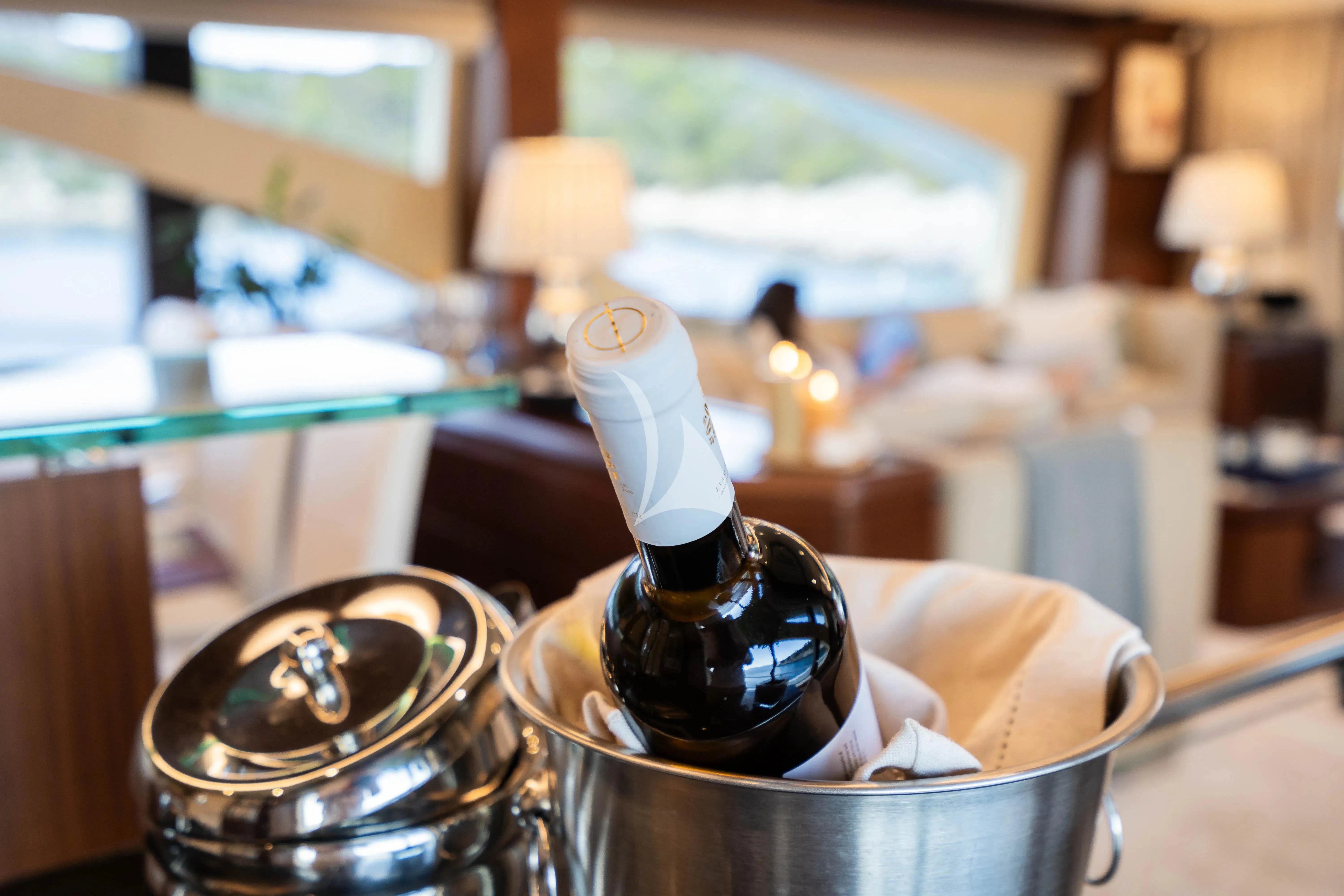 a bottle of liquor in a bucket aboard KOUKLES Yacht for Sale