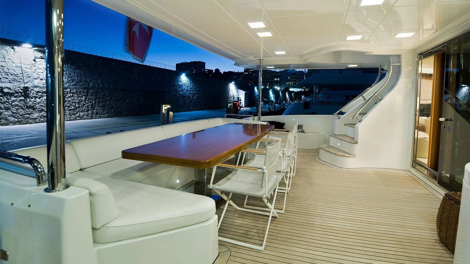 a room with a table and chairs aboard KOUKLES Yacht for Sale