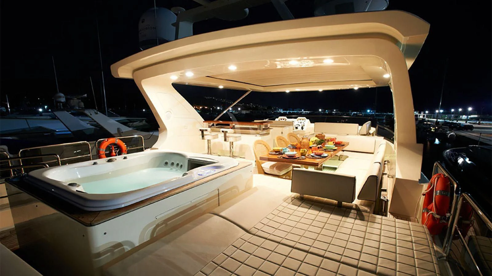 a room with a table and chairs aboard KOUKLES Yacht for Sale