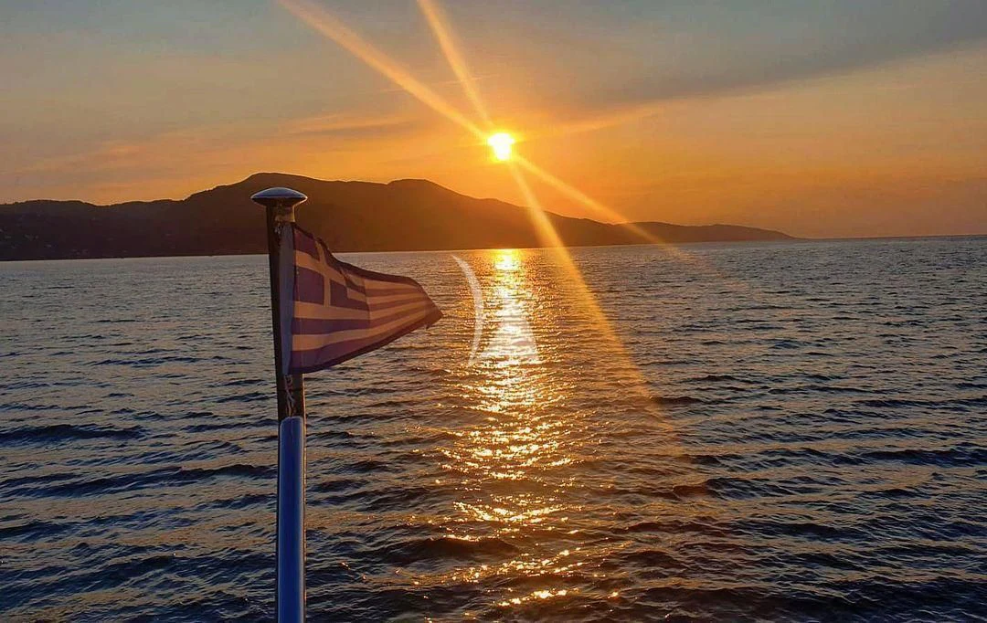 a flag on a pole in the water aboard KOUKLES Yacht for Sale