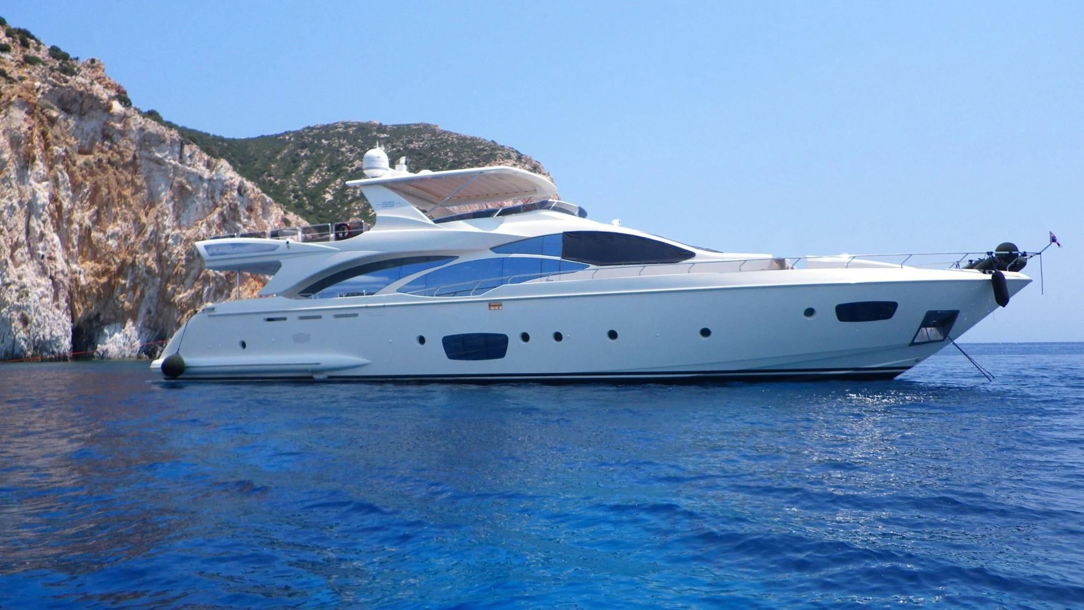 a white yacht in the water aboard KOUKLES Yacht for Sale