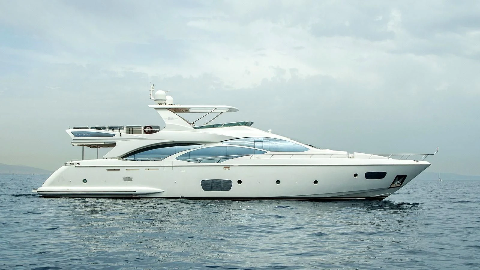 a white yacht in the water aboard KOUKLES Yacht for Sale