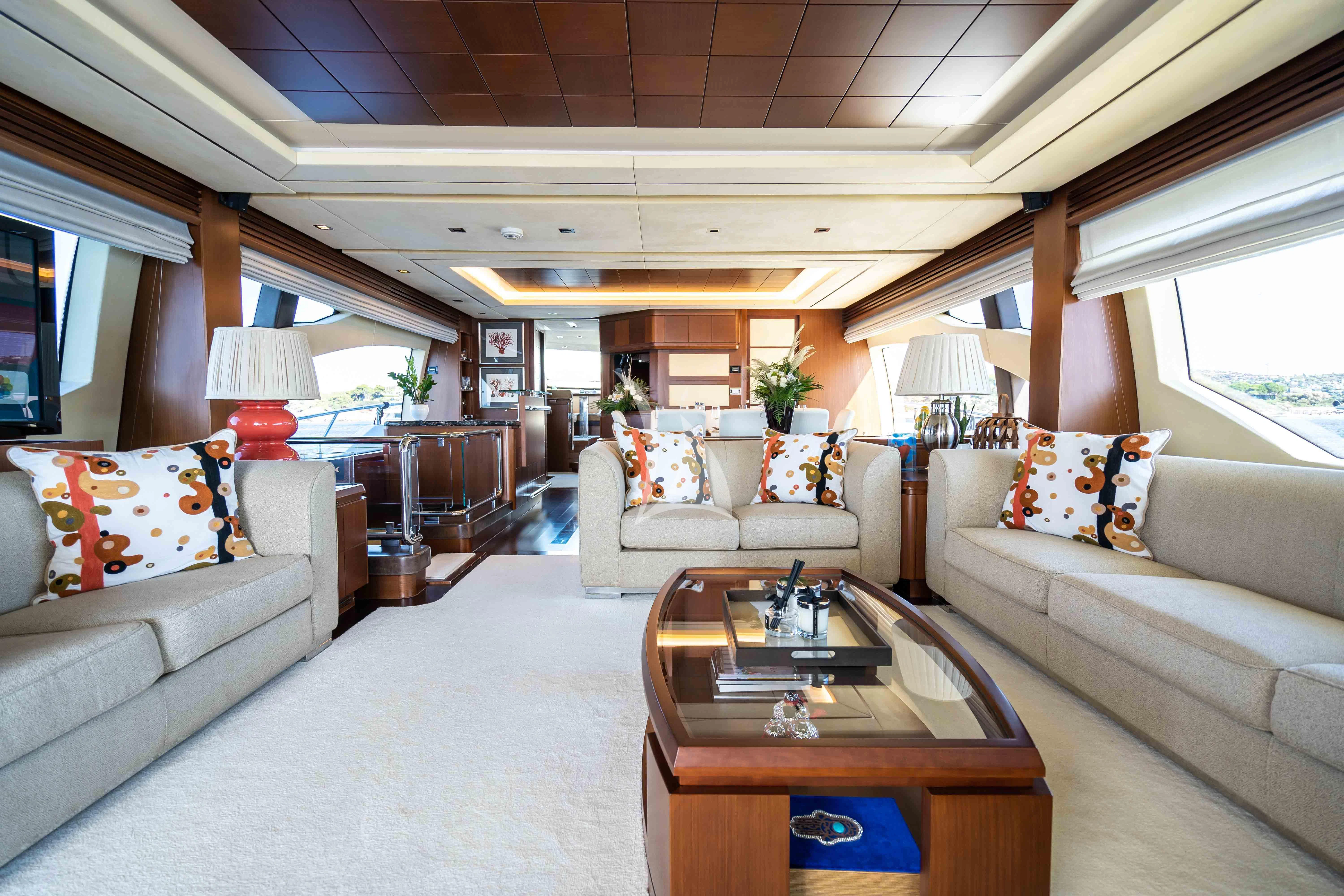 a living room with a couch and a coffee table aboard KOUKLES Yacht for Sale