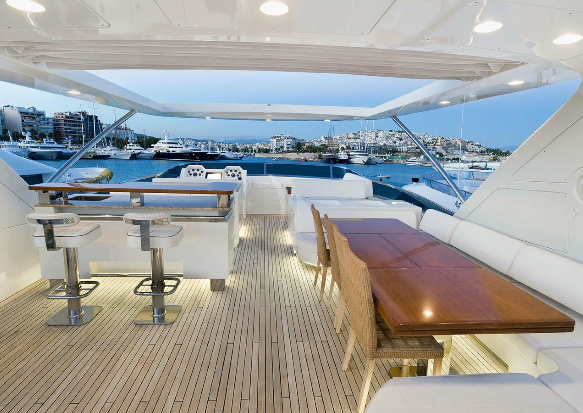 a room with a deck and a pool aboard KOUKLES Yacht for Sale