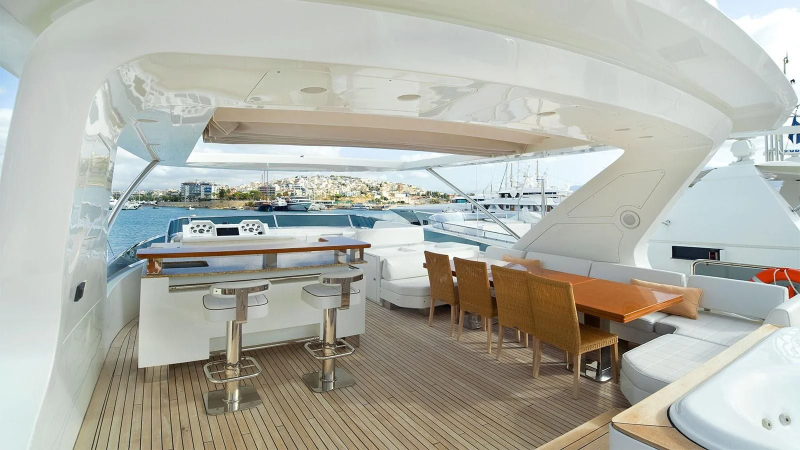 a room with a table and chairs aboard KOUKLES Yacht for Sale
