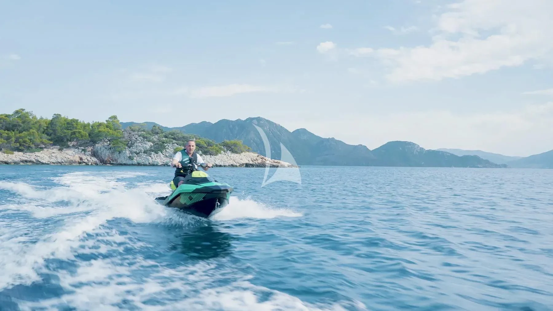 a man on a jet ski aboard KOUKLES Yacht for Sale