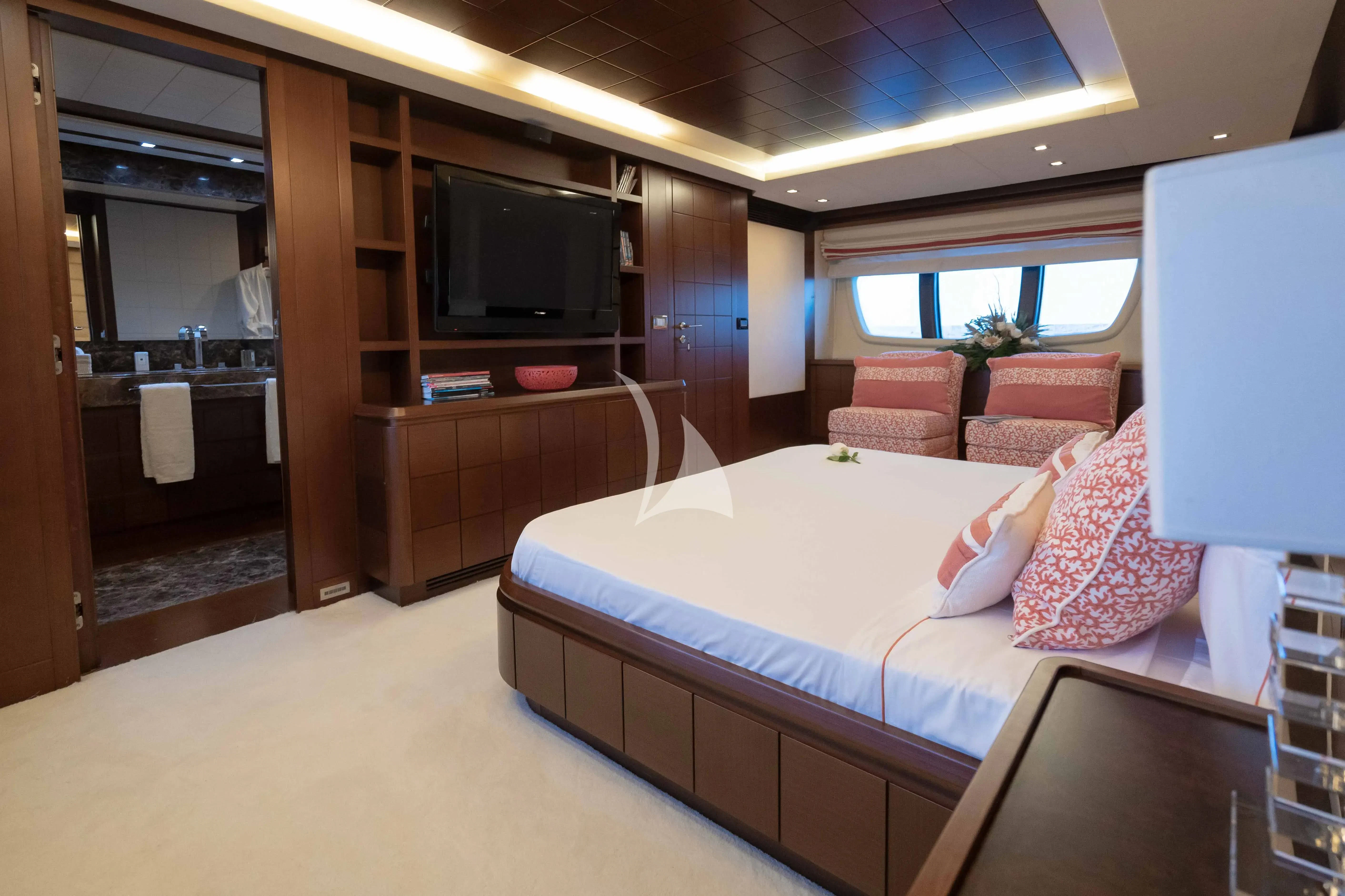 a room with a bed and a tv aboard KOUKLES Yacht for Sale