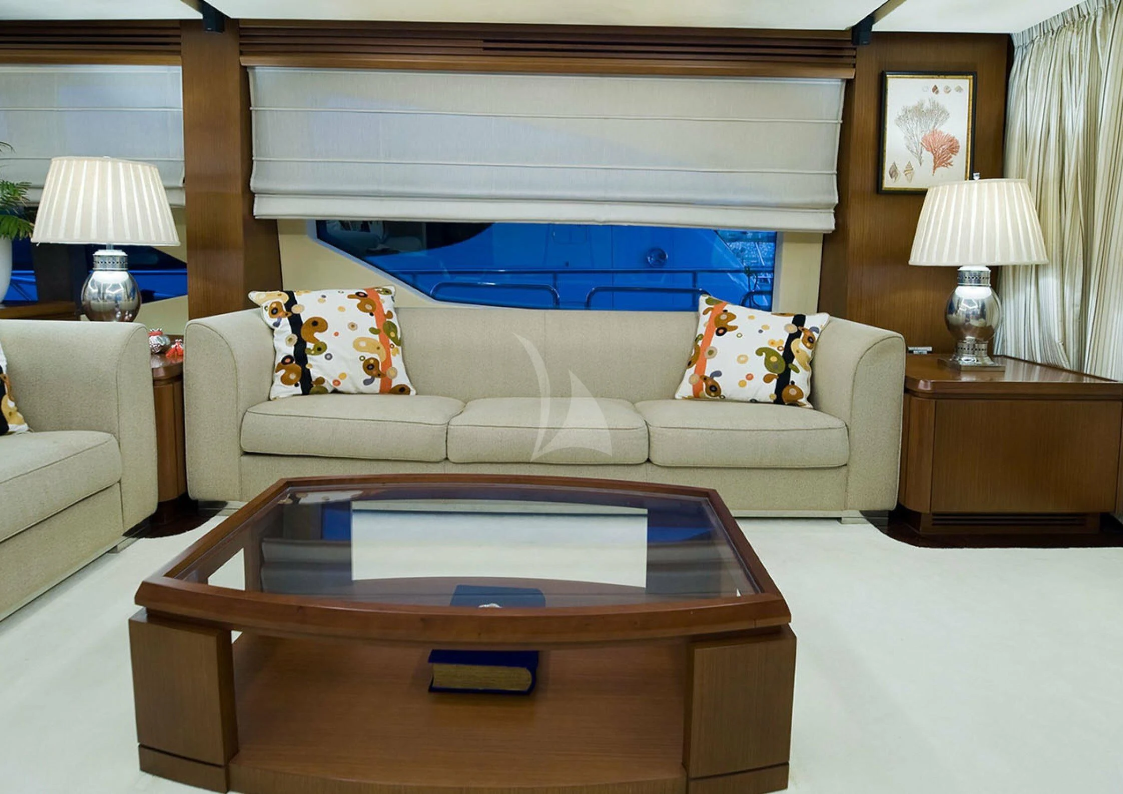 a living room with a white couch aboard KOUKLES Yacht for Sale