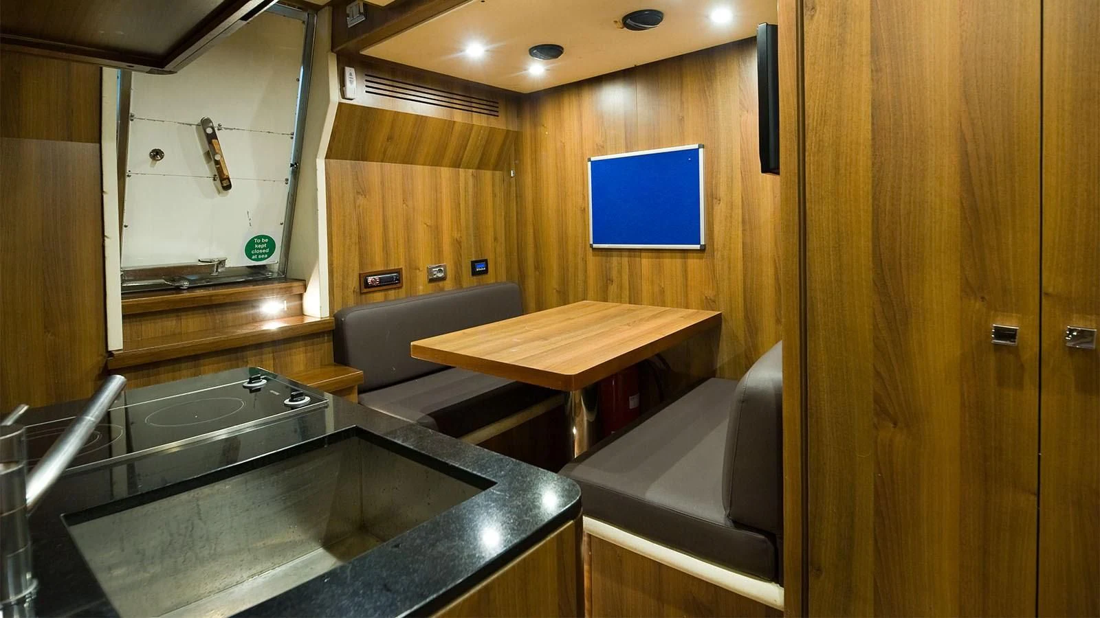a kitchen with a sink and a counter aboard KOUKLES Yacht for Sale