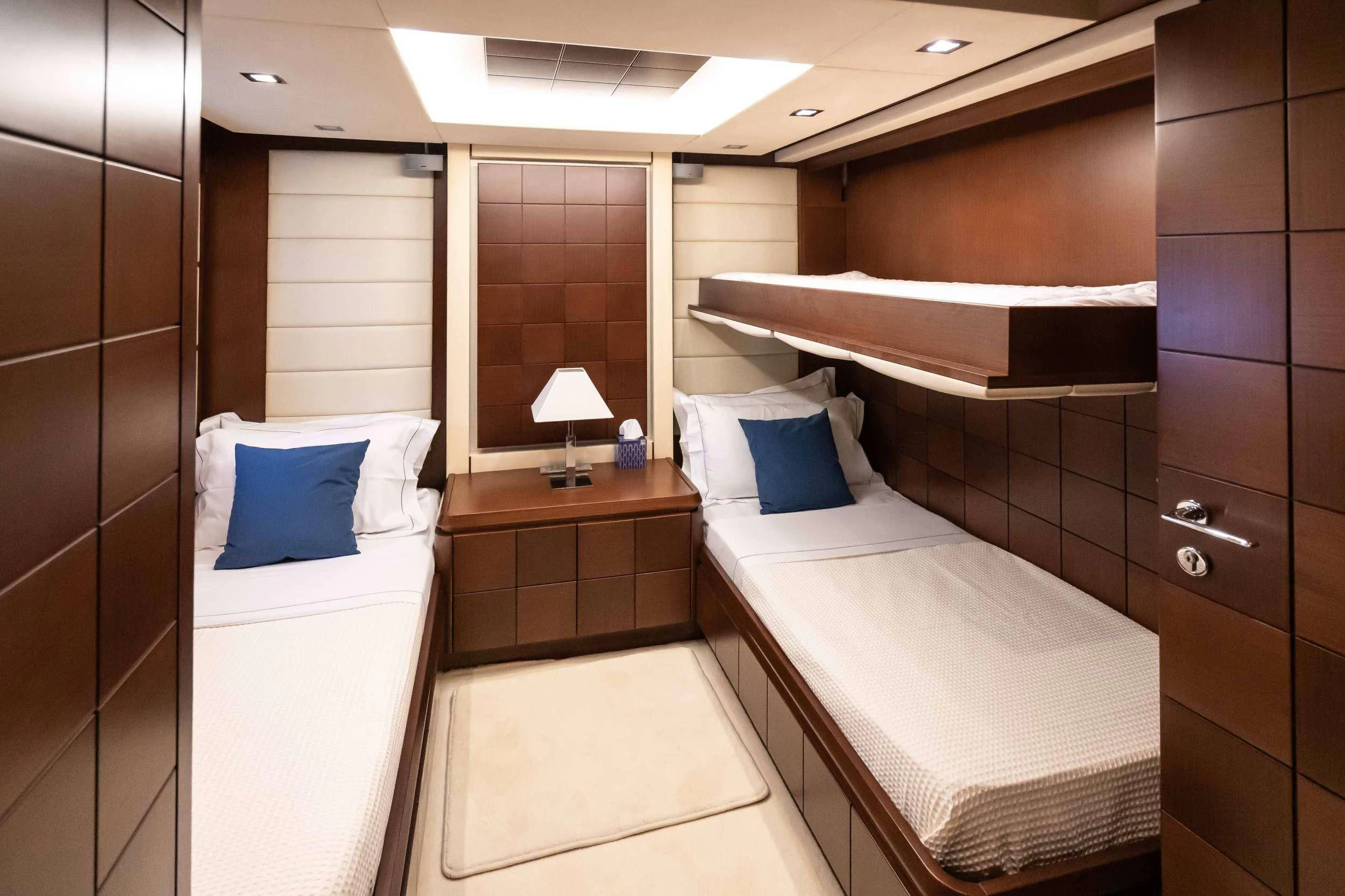 a room with two beds aboard KOUKLES Yacht for Sale