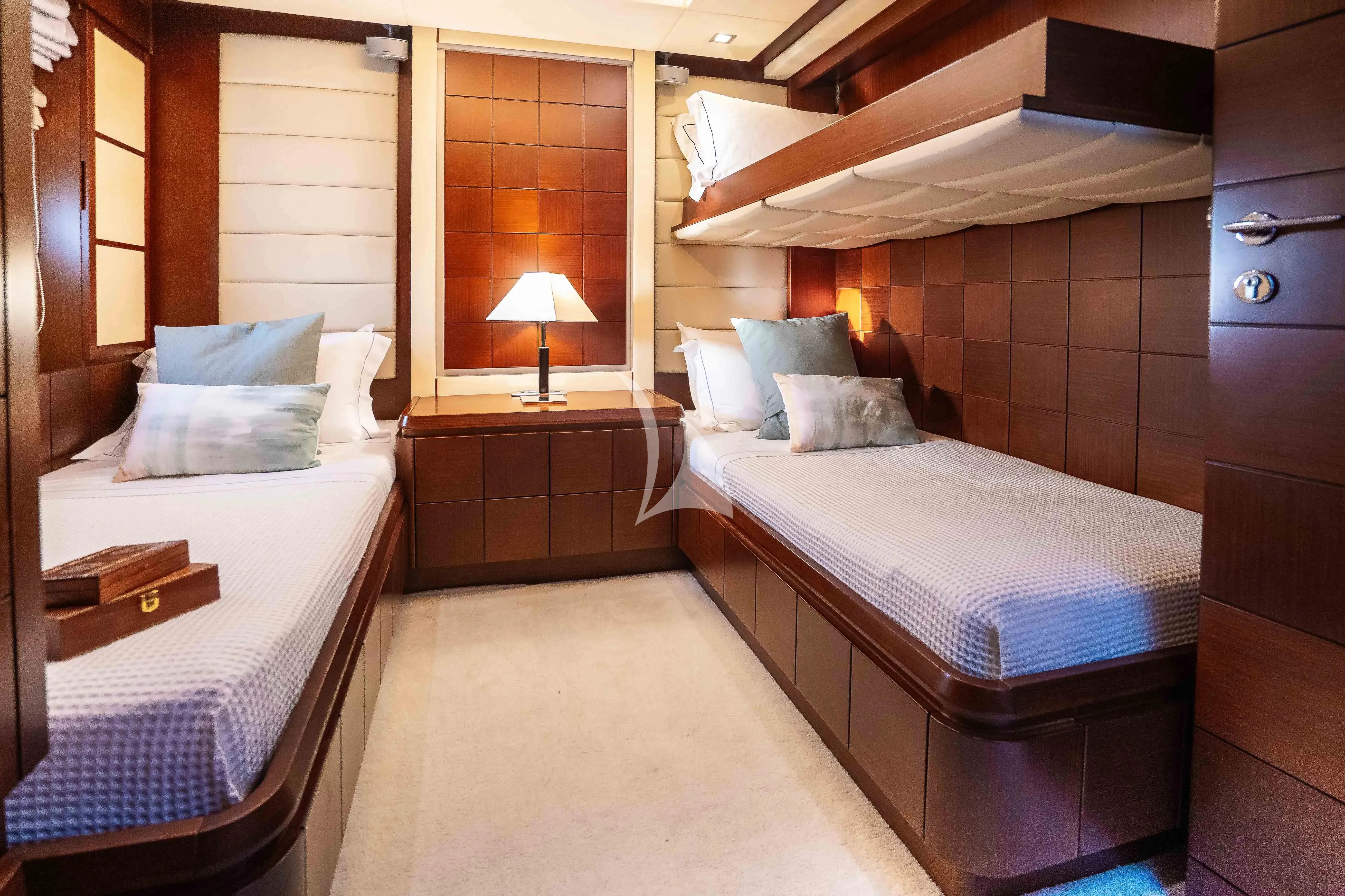a room with two beds aboard KOUKLES Yacht for Sale