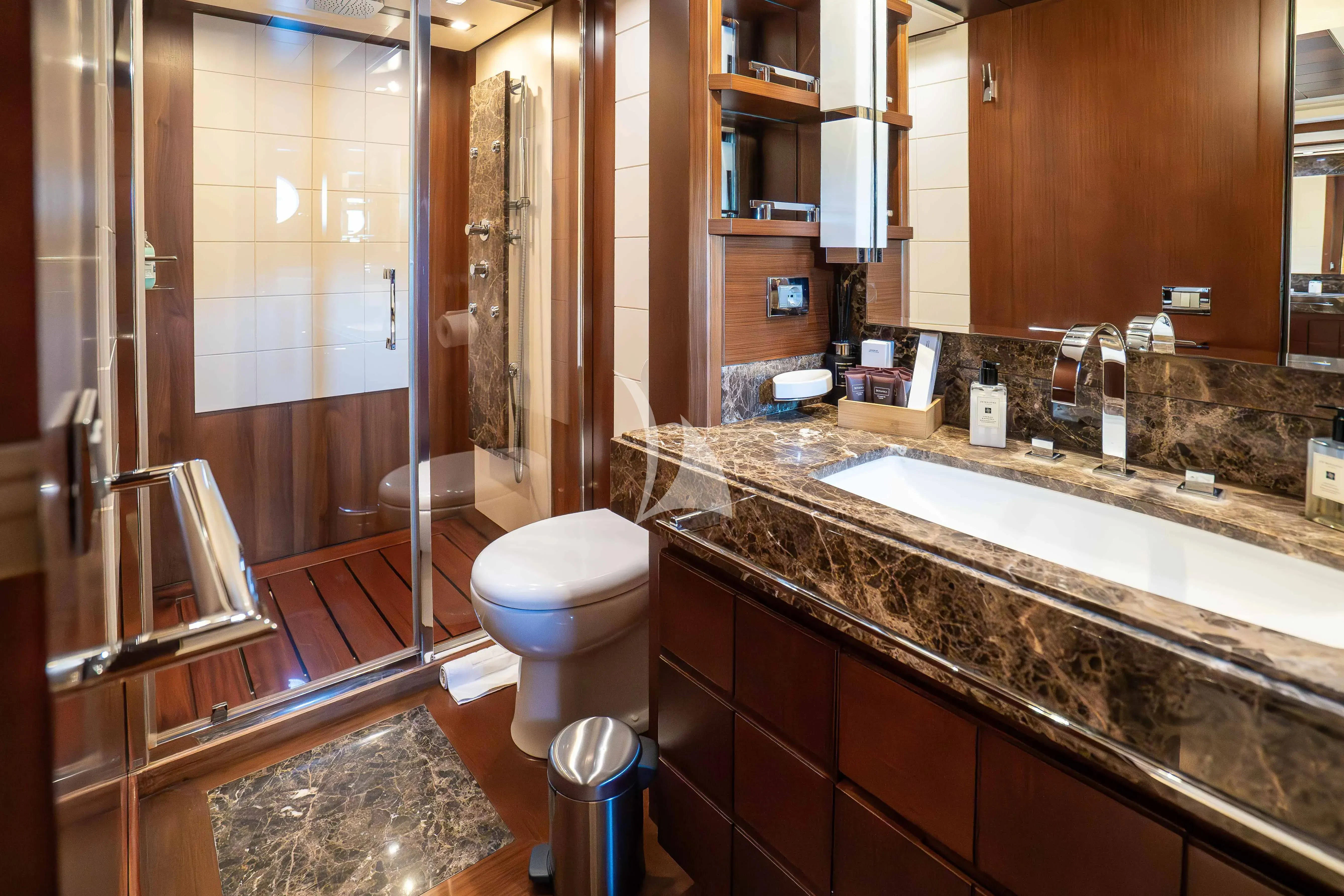 a bathroom with a countertop sink and a shower unit aboard KOUKLES Yacht for Sale
