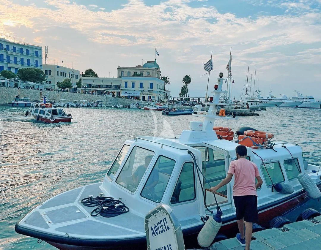 a person standing on a boat aboard KOUKLES Yacht for Sale