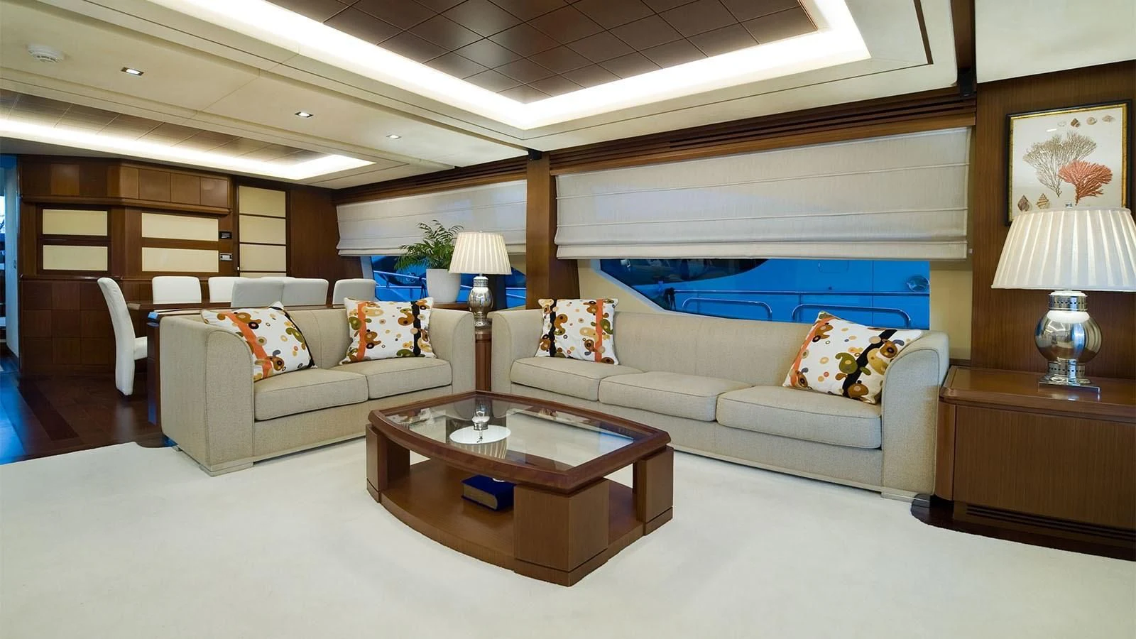 a living room with a couch and a coffee table aboard KOUKLES Yacht for Sale
