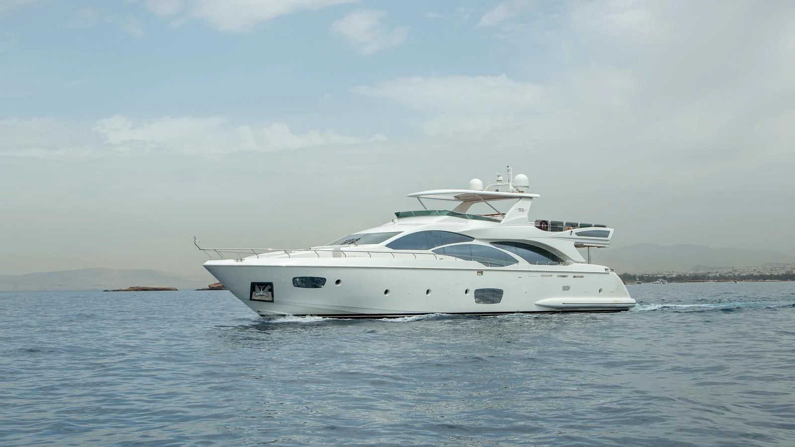 a white yacht on the water aboard KOUKLES Yacht for Sale