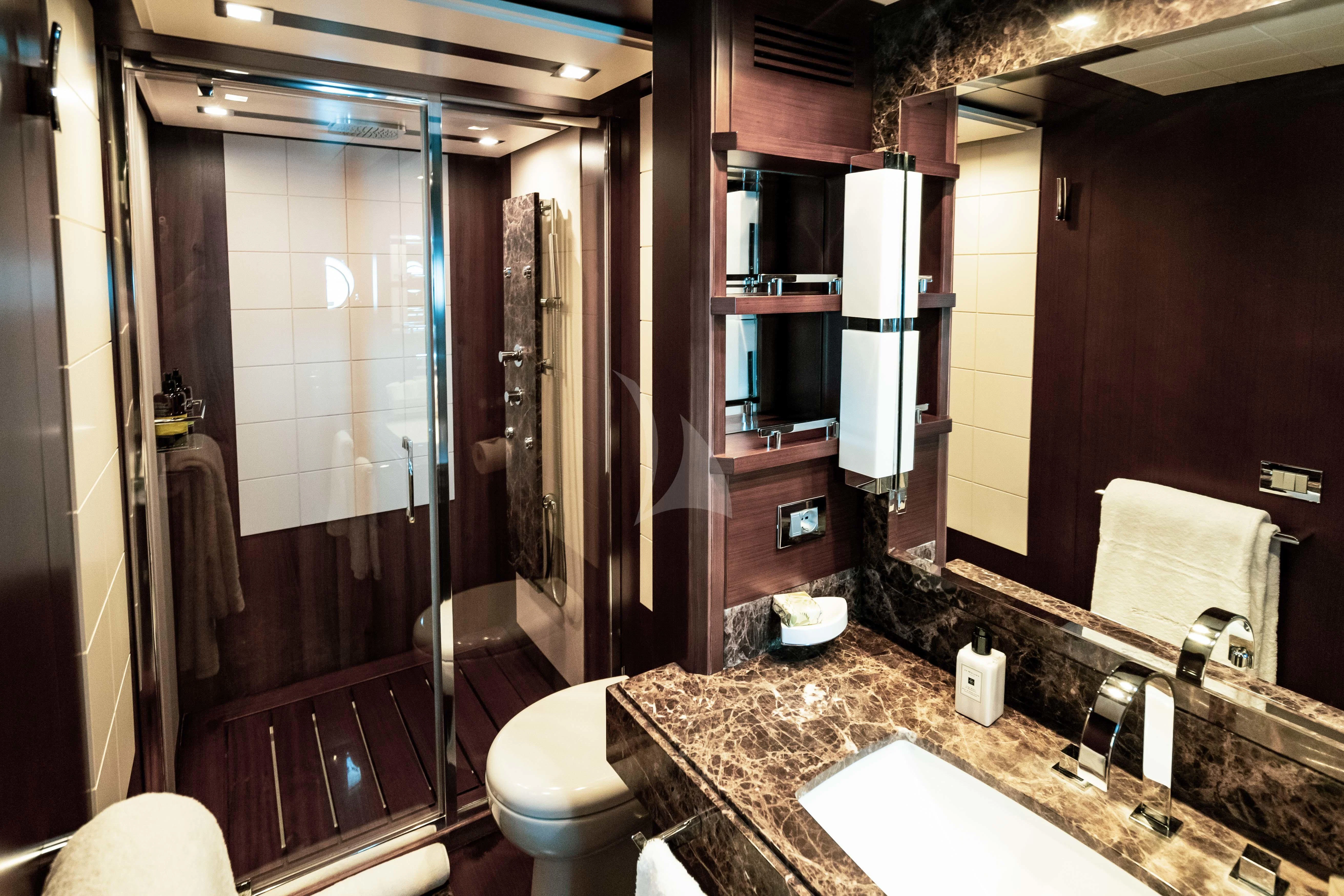 a bathroom with a countertop sink and a shower aboard KOUKLES Yacht for Sale
