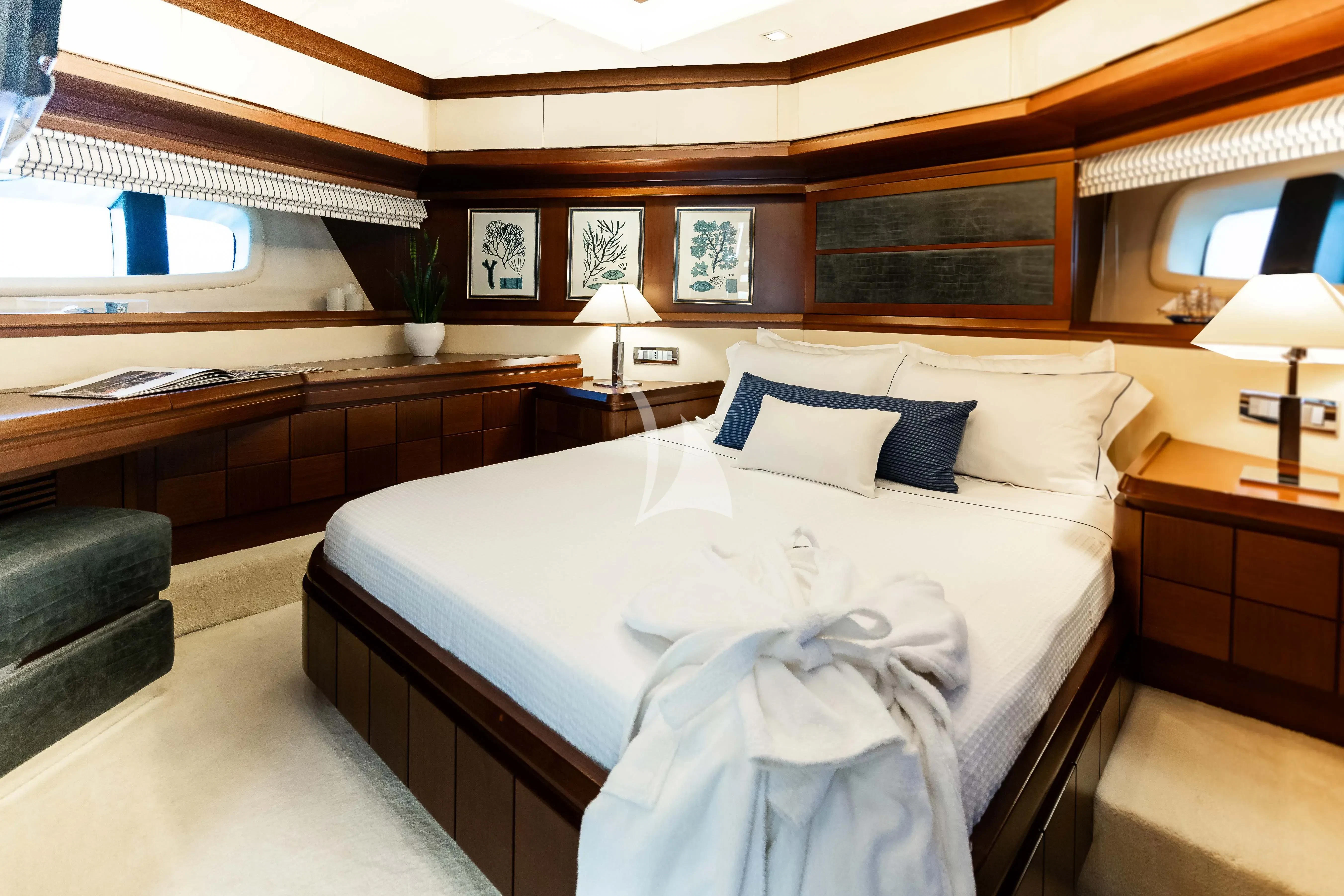 a room with a bed and a couch aboard KOUKLES Yacht for Sale