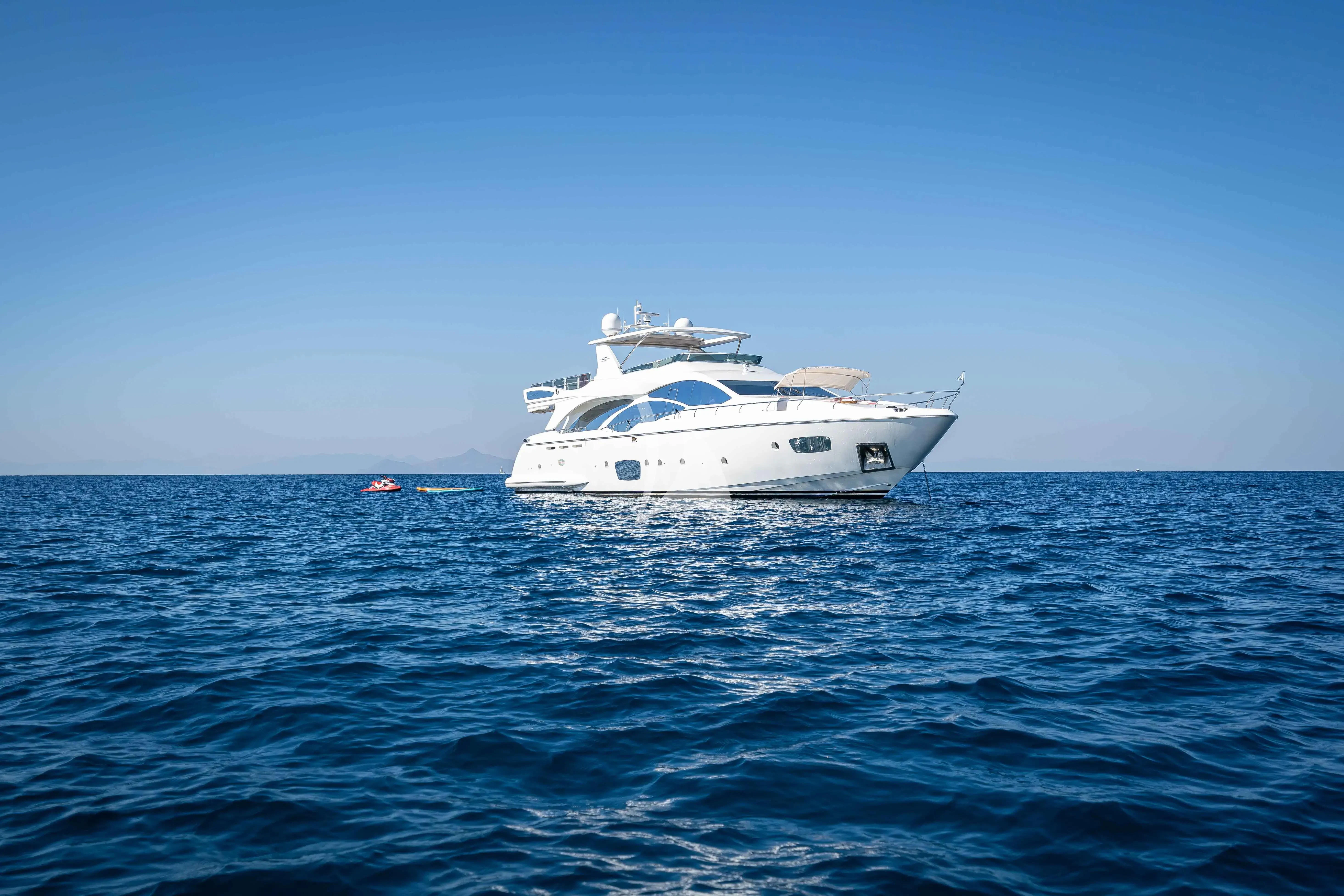 a white yacht in the water aboard KOUKLES Yacht for Sale