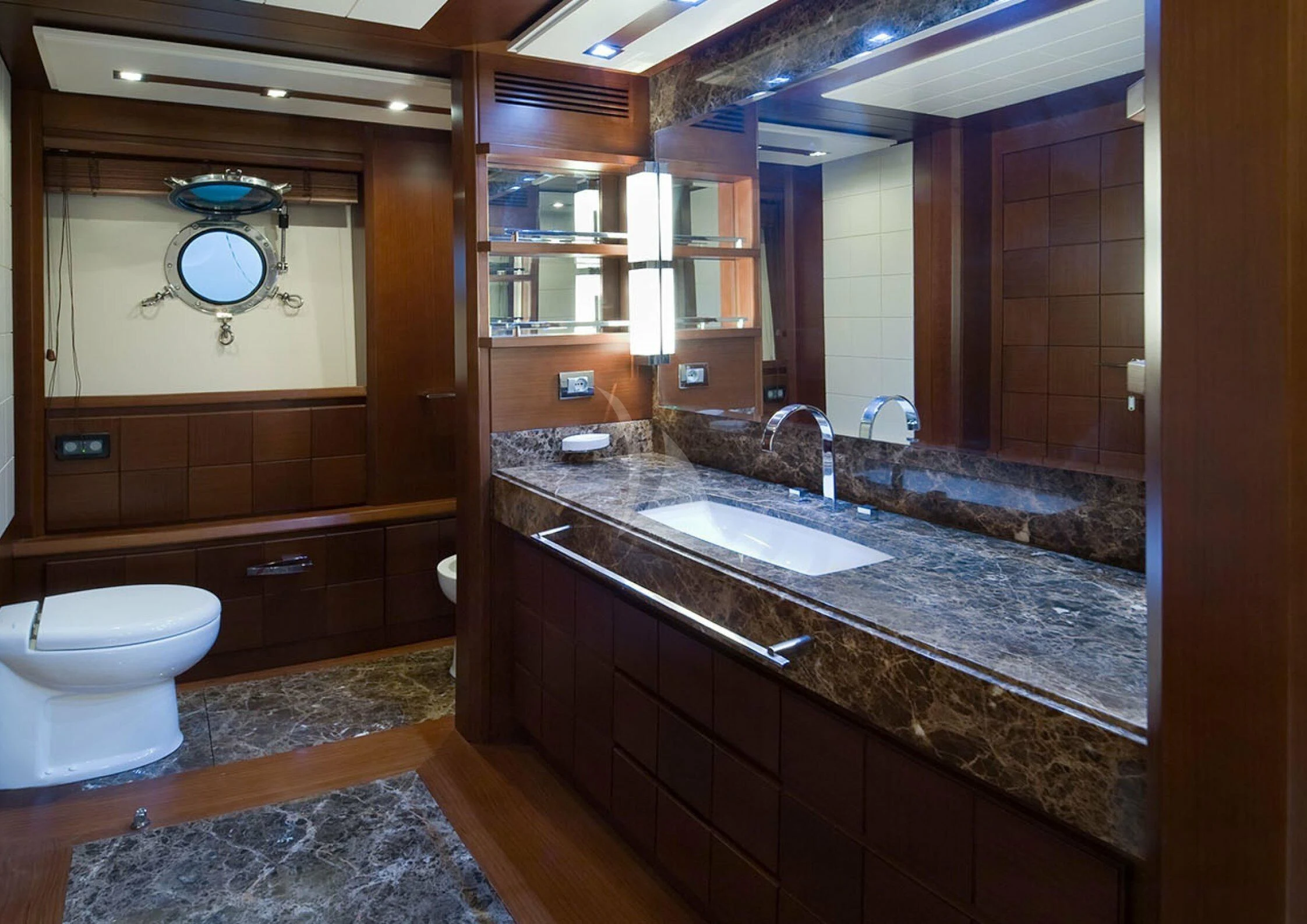 a bathroom with a large marble countertop aboard KOUKLES Yacht for Sale