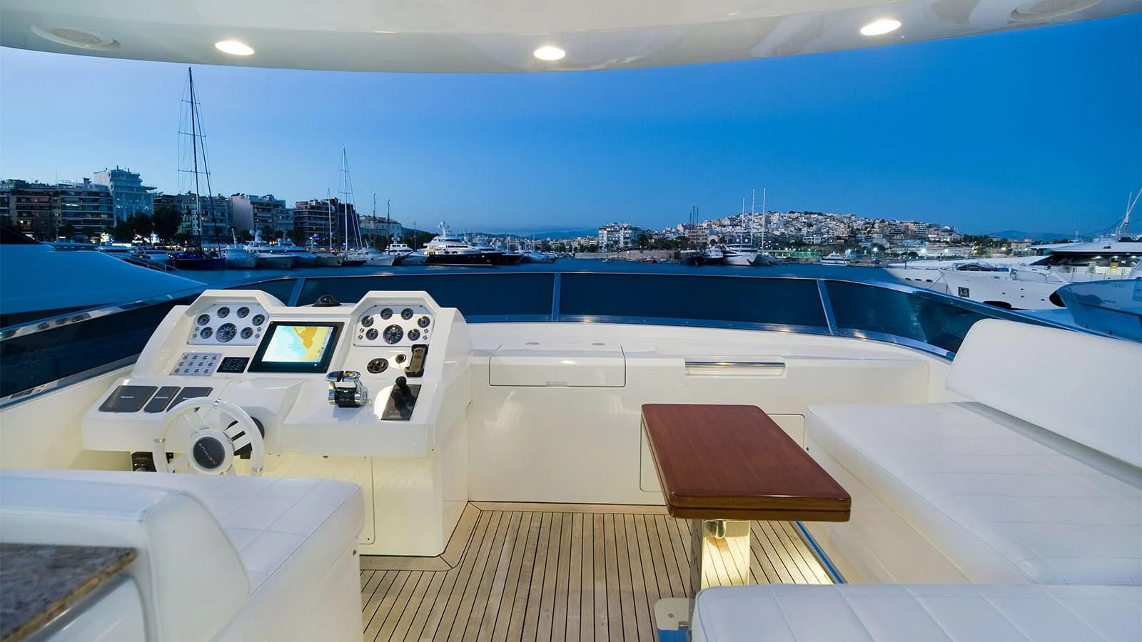 a large model ship in a harbor aboard KOUKLES Yacht for Sale