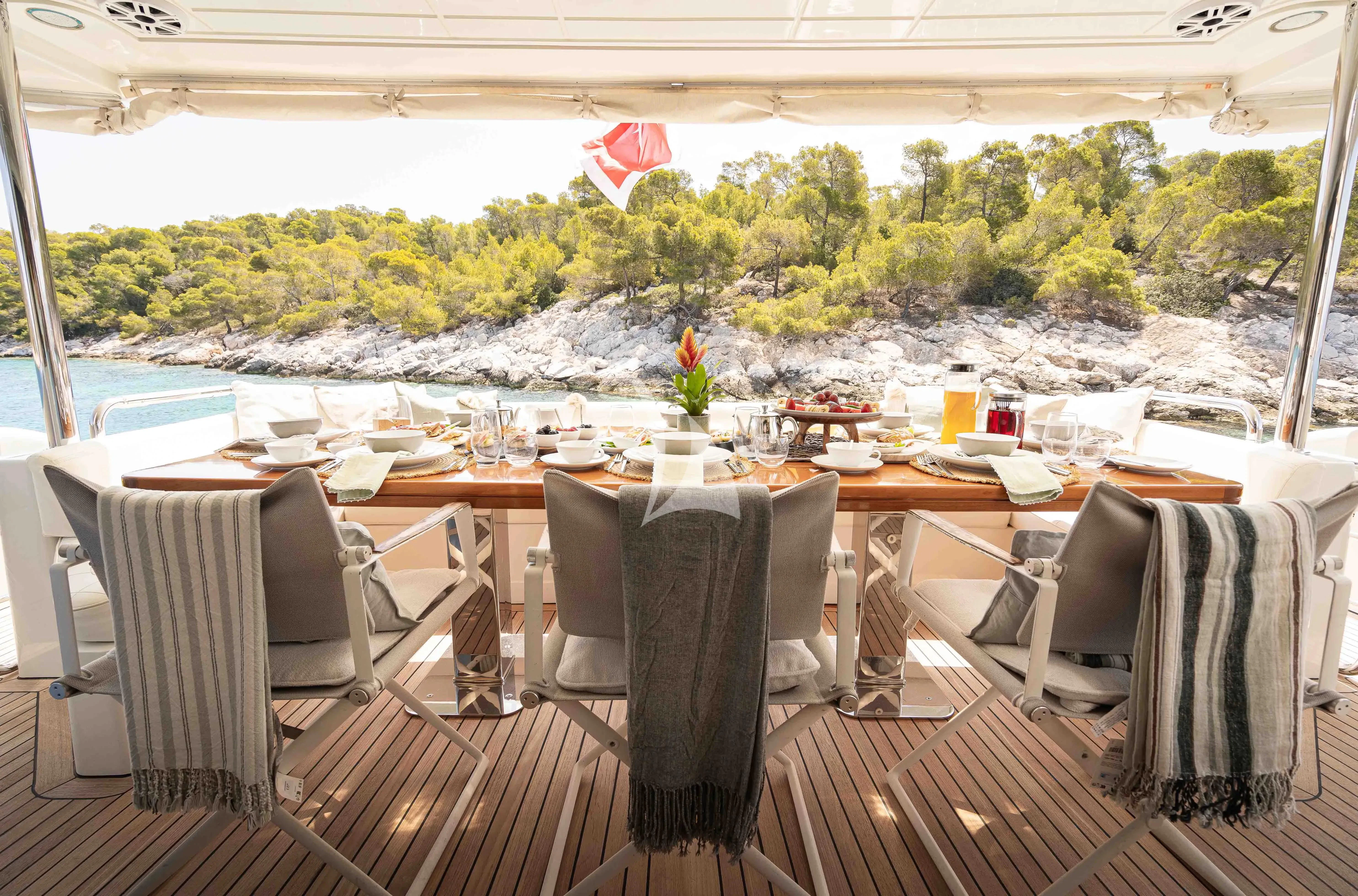 a table set for a dinner party aboard KOUKLES Yacht for Sale