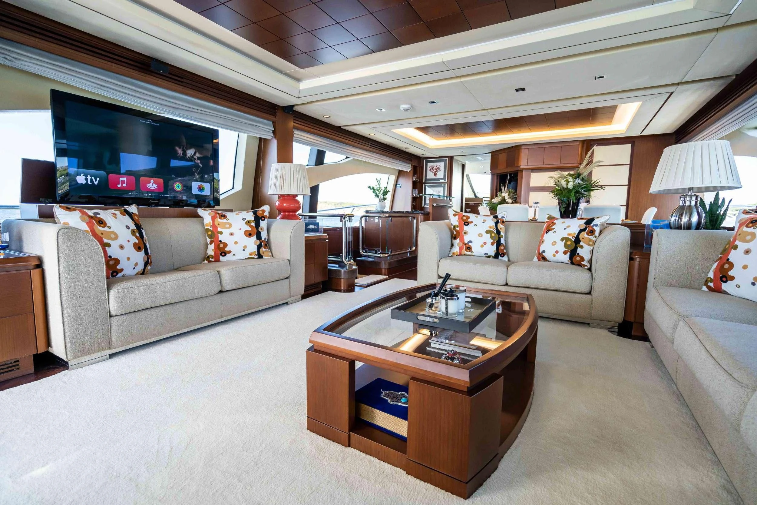 a living room with a large screen aboard KOUKLES Yacht for Sale