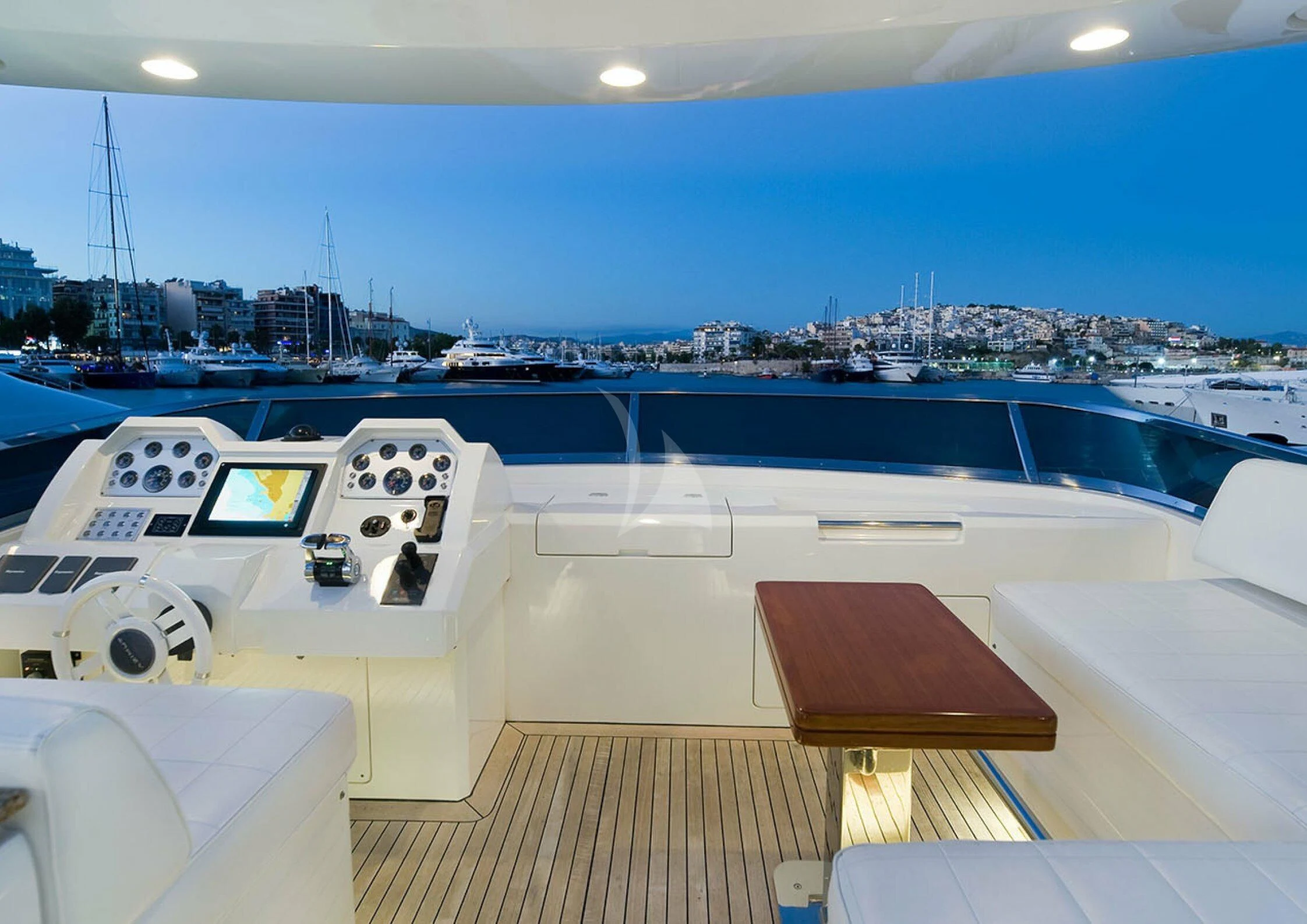 a room with a large pool and a large city in the background aboard KOUKLES Yacht for Sale