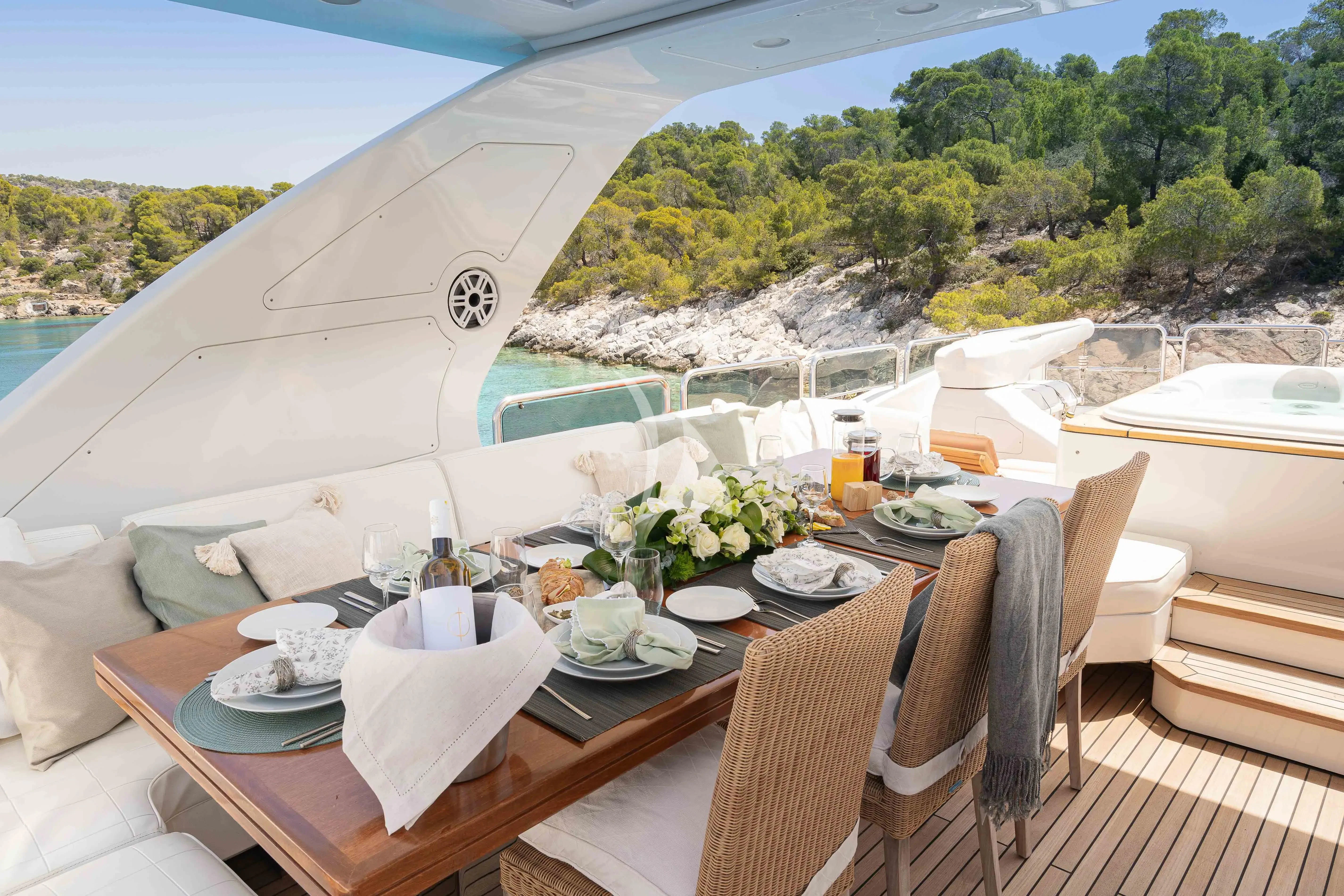 a table set for a meal aboard KOUKLES Yacht for Sale