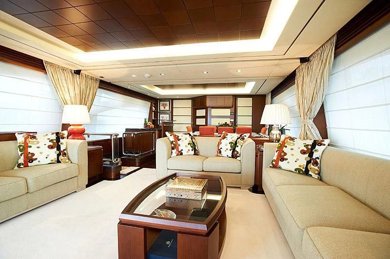 a living room with a couch and a coffee table aboard KOUKLES Yacht for Sale
