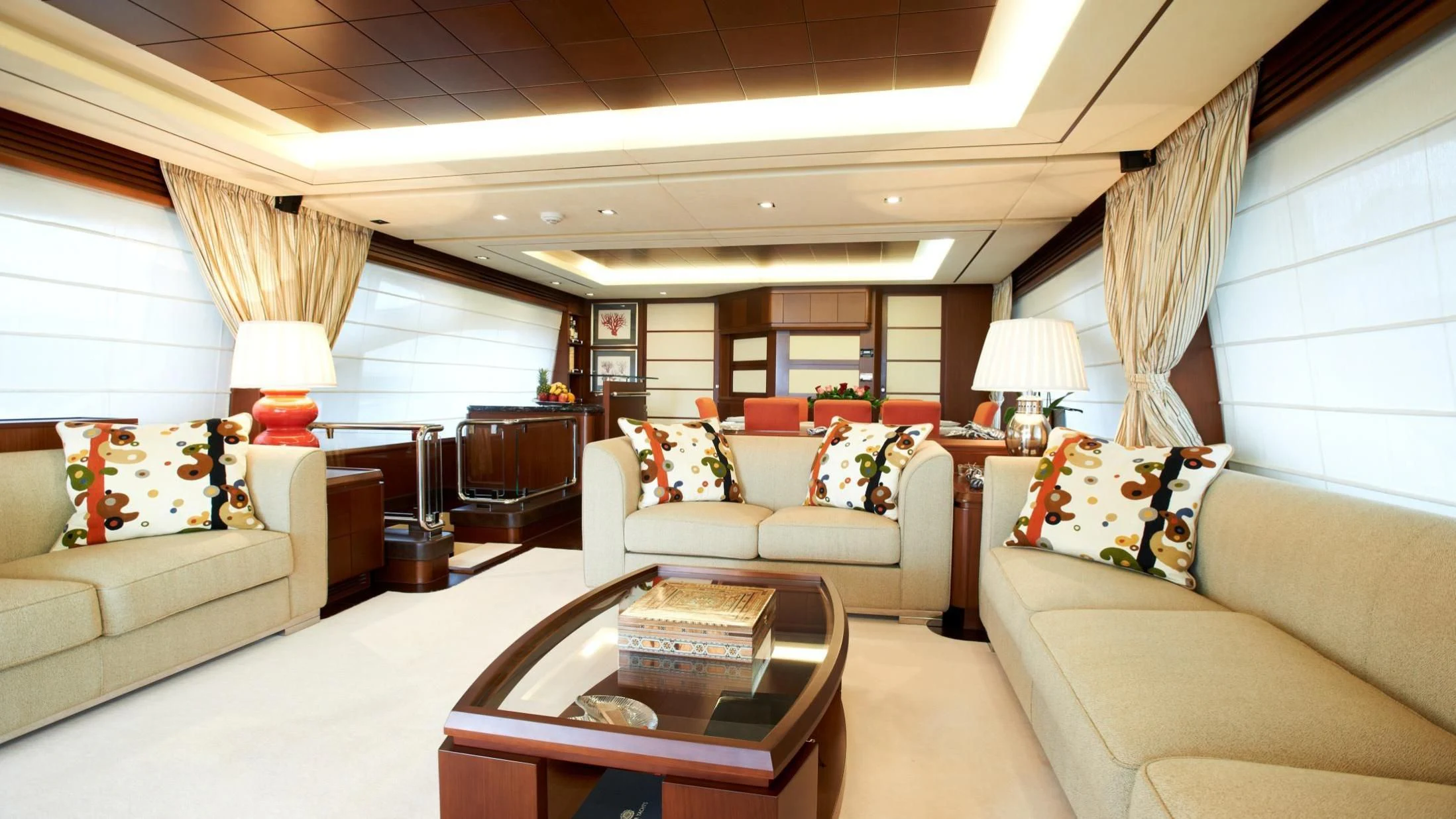 a living room with a couch and a coffee table aboard KOUKLES Yacht for Sale