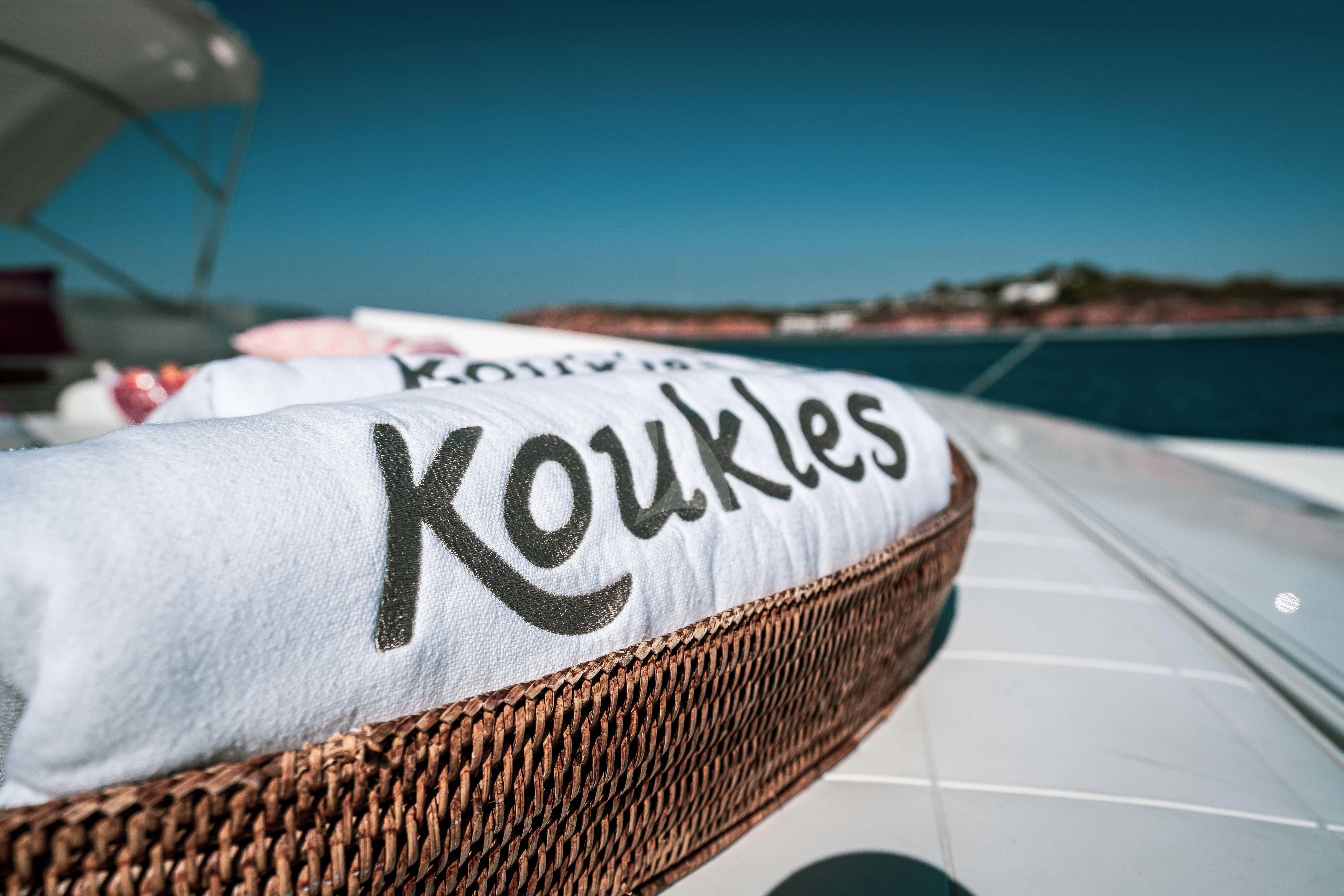 a hat on a car aboard KOUKLES Yacht for Sale